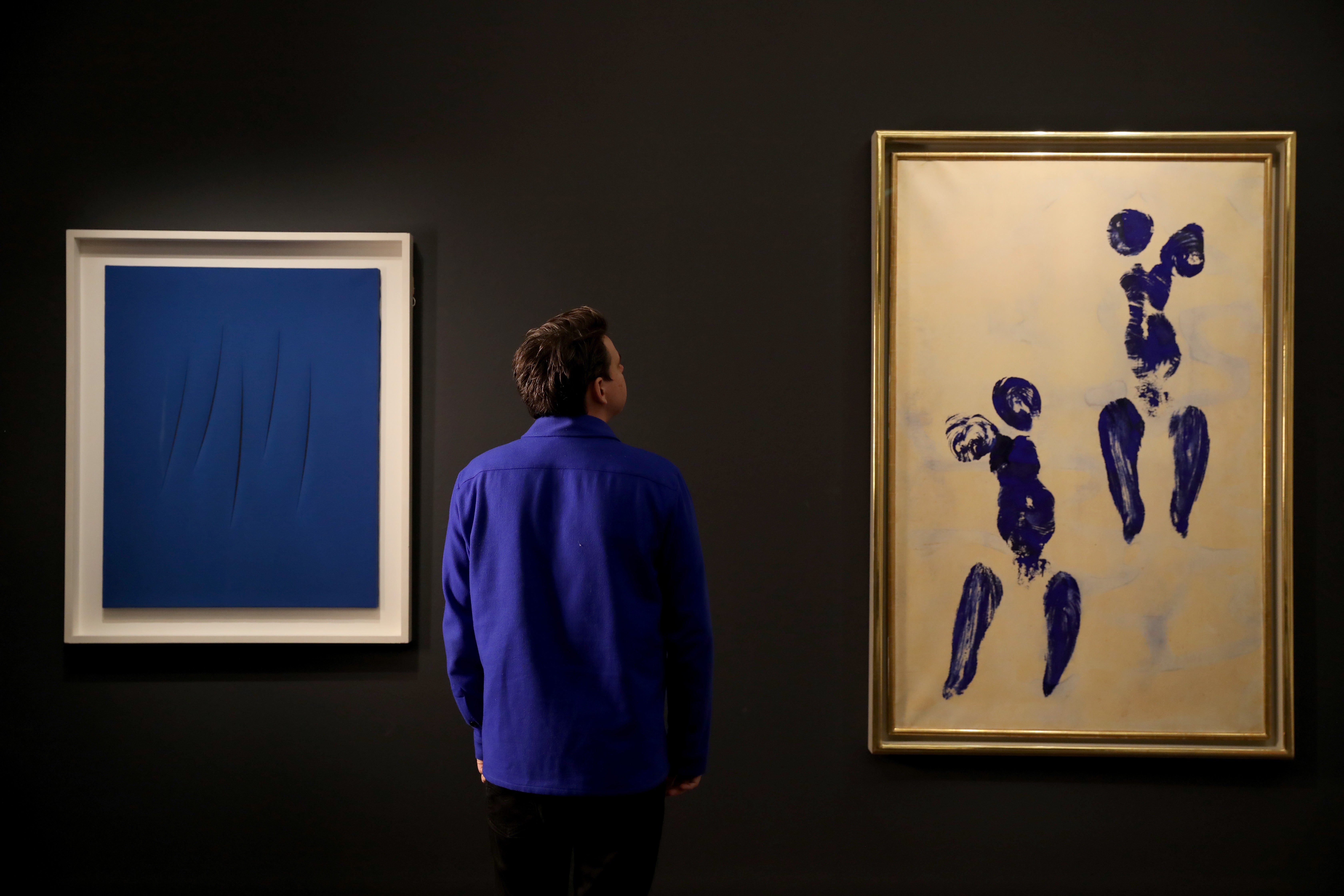 ‘UNTITLED ANTHROPOMETRY (ANT 132)’ by Yves Klein (right) displayed at Sotheby's in London
