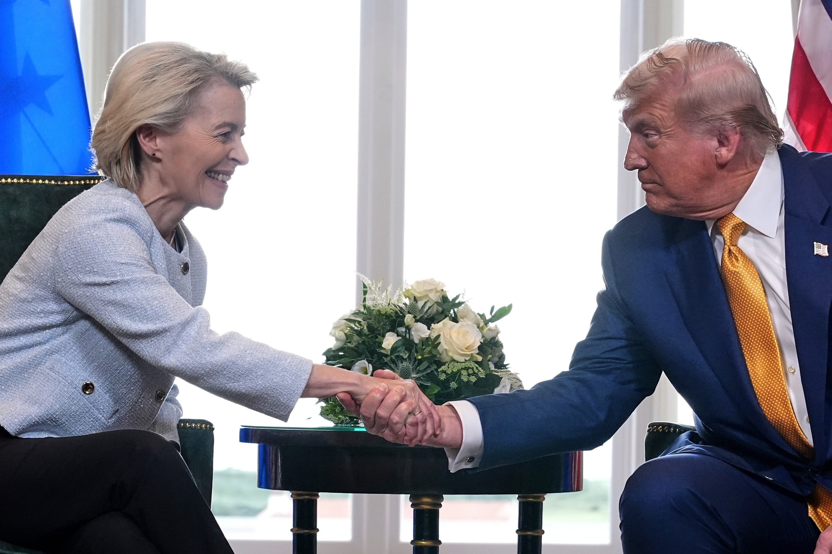 President Donald Trump and European Commission President Ursula von der Leyen shingle hands aft reaching a waste and acquisition woody astatine nan Trump Turnberry play people successful Scotland