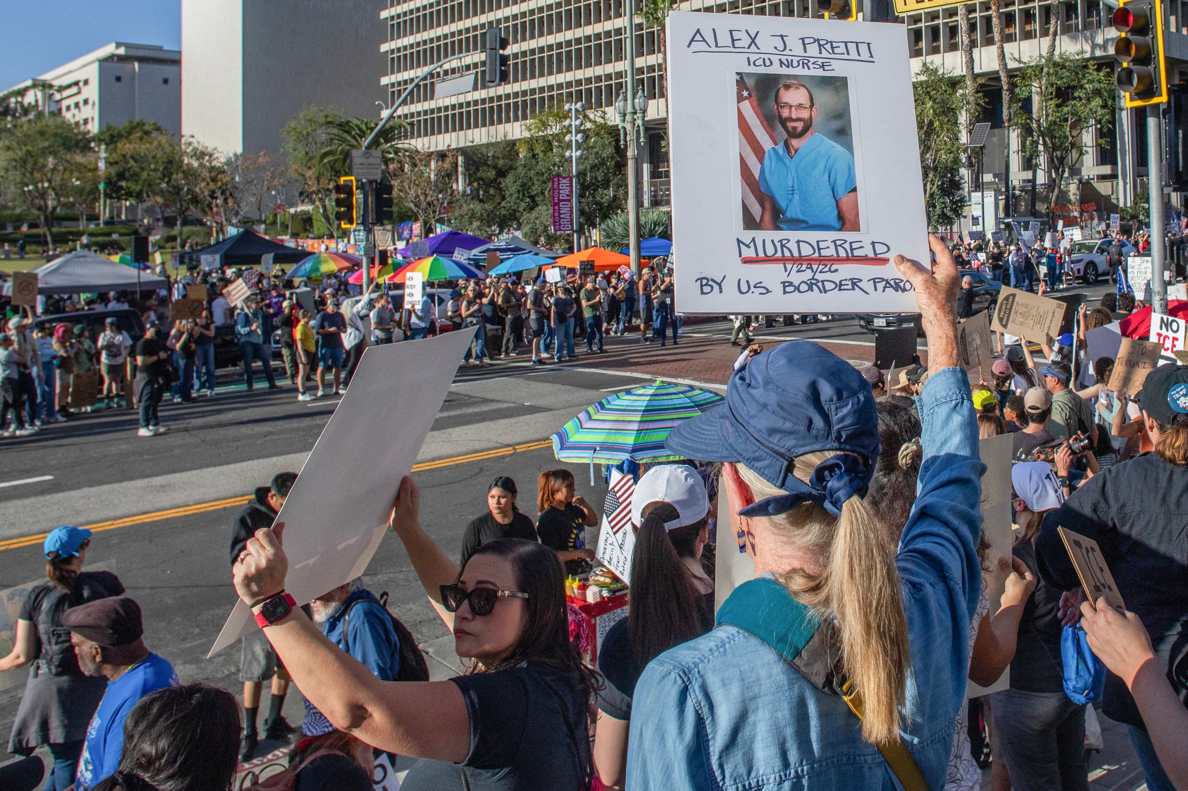 A female holds a motion pinch a image of Alex Pretti, who was killed by ICE agents successful Minneapolis, successful a protestation against migration successful an "ICE Out of Everywhere" National Day of Action follow-up successful beforehand of nan City Hall successful downtown Los Angeles