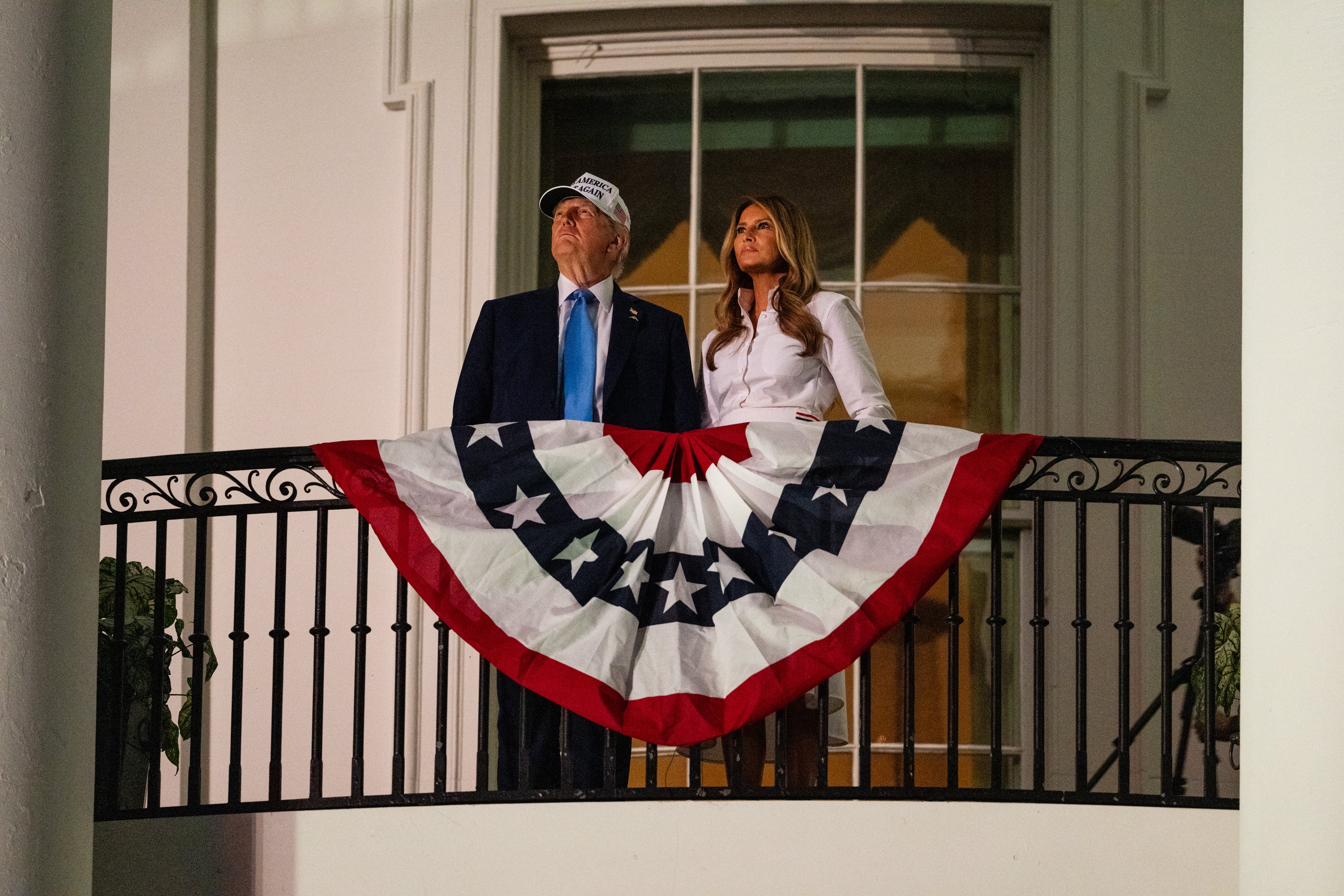 President Donald Trump, seen present watching fireworks pinch first Lady Melania Trump from nan White House successful 2025 is reportedly utilizing $90 cardinal successful fees for nationalist parks passes to salary for this year’s $1.6 cardinal pyrotechnics show