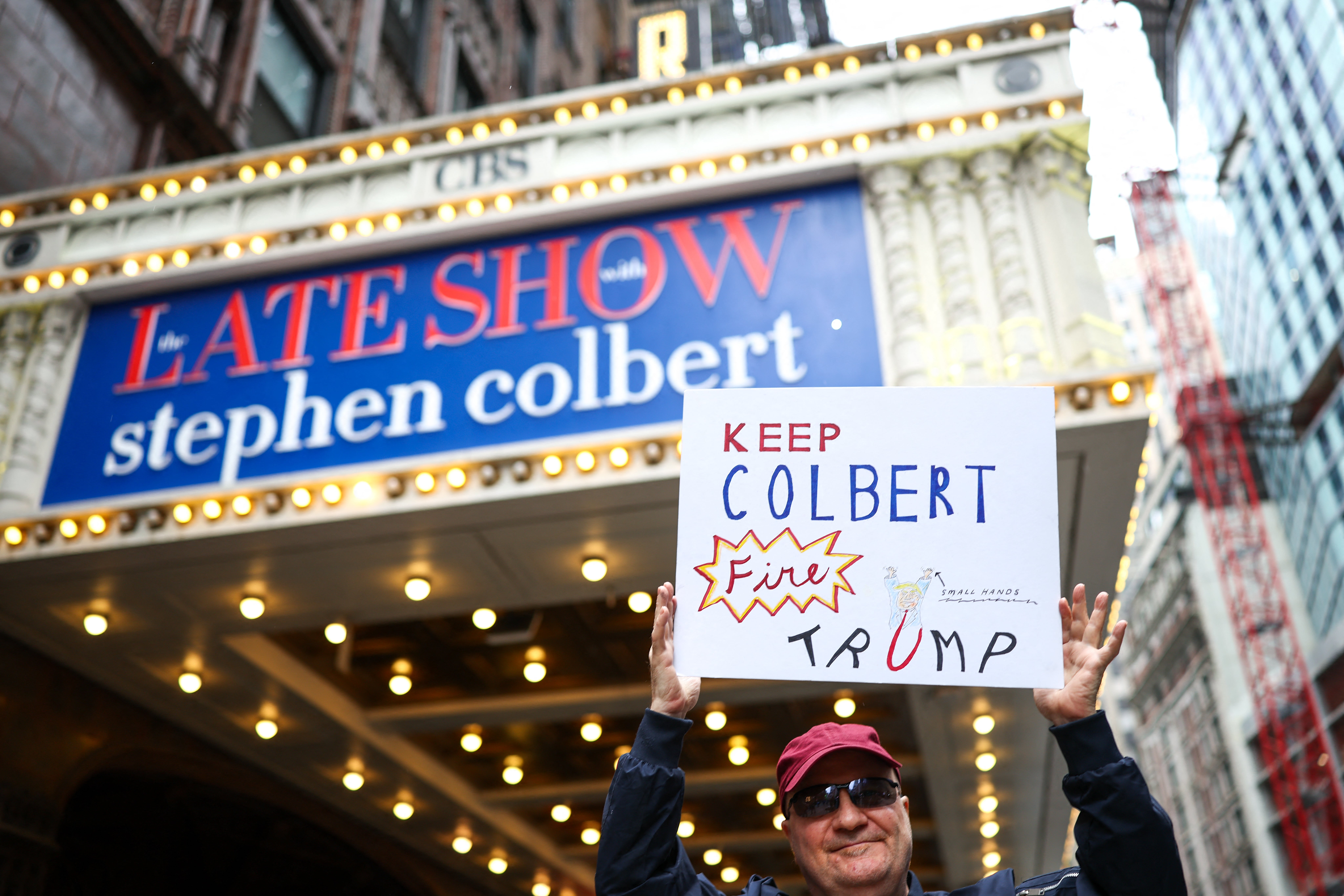 A man holds a motion extracurricular nan Ed Sullivan Theater up of nan taping of nan last section of nan "The Late Show" successful New York, connected May 21, 2026