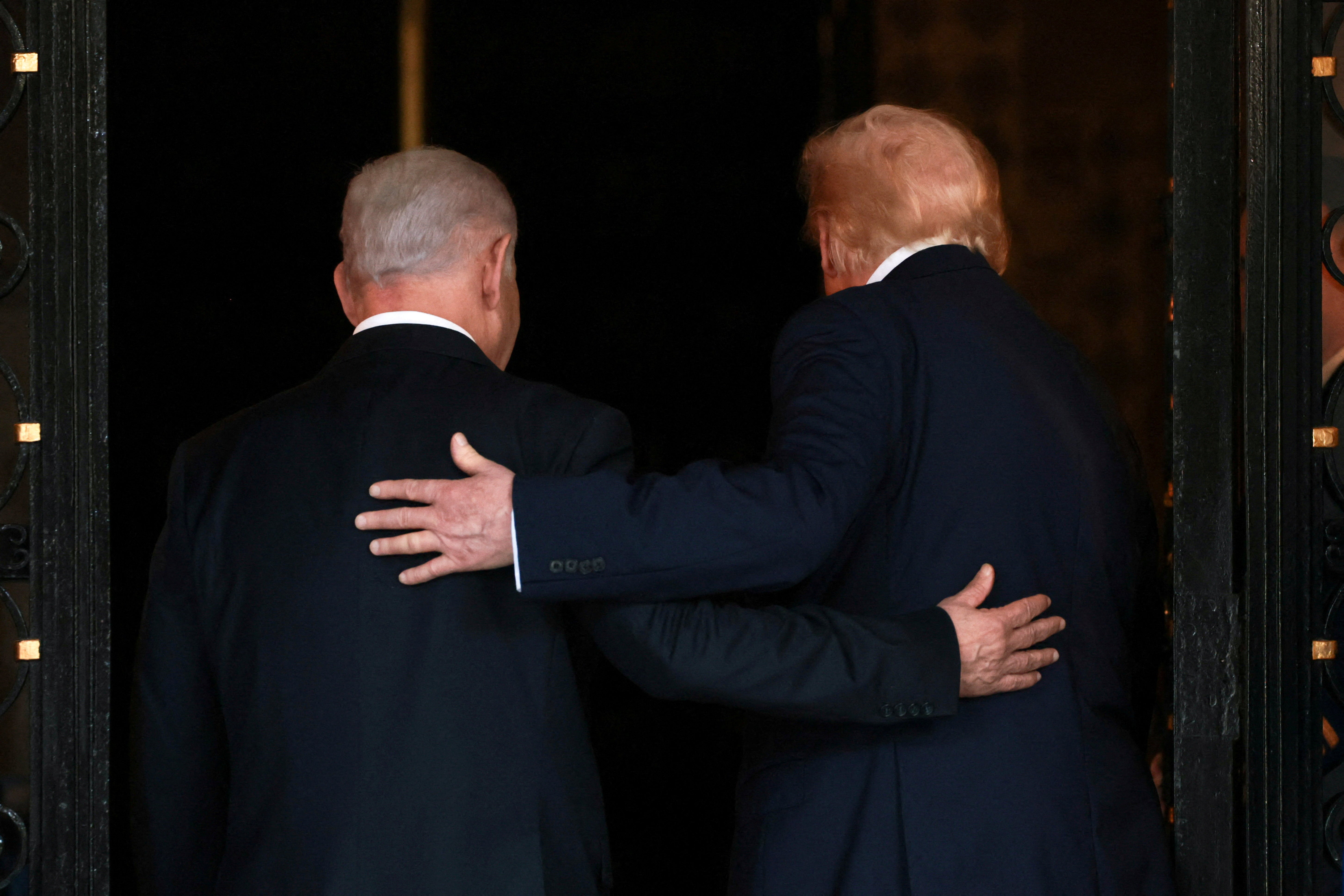 US. President Donald Trump and Israeli Prime Minister Benjamin Netanyahu clasp arsenic they locomotion into Trump's Mar-a-Lago nine successful Palm Beach, Florida, U.S., December 29, 2025.