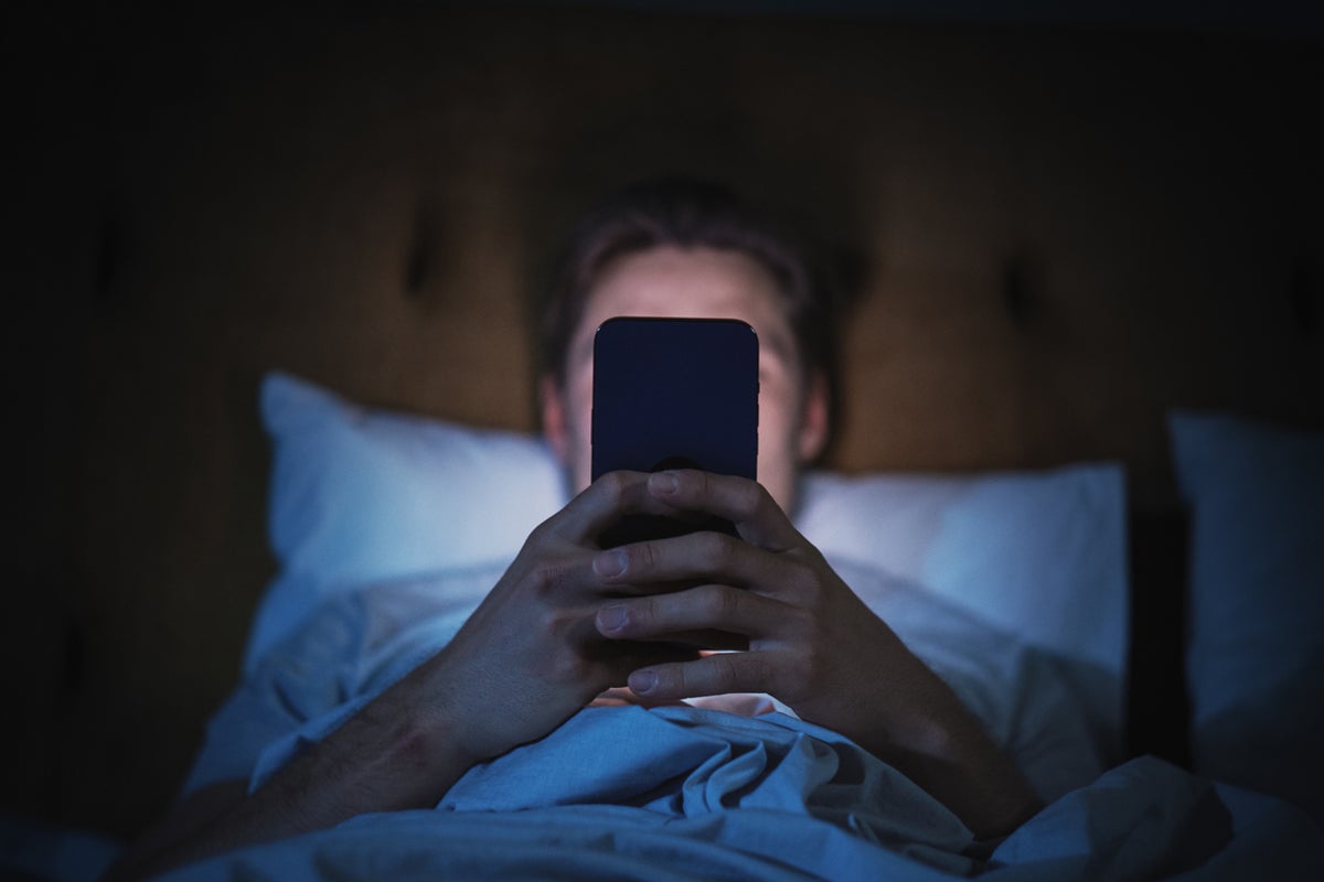 Why scrolling on your phone before bed hurts your sleep more than you realize, according to experts