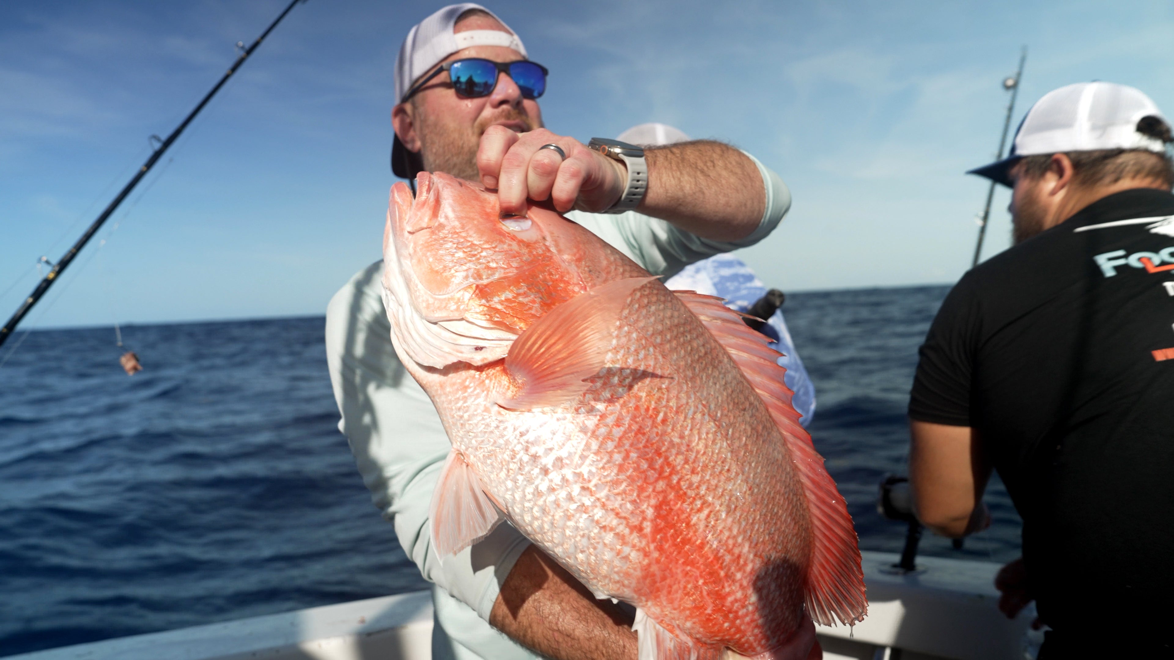 Chris Kemp holds up a reddish snapper he caught connected nan charter vessel Jodie Lynn II, earlier releasing it backmost into nan h2o miles disconnected nan seashore of St. Augustine