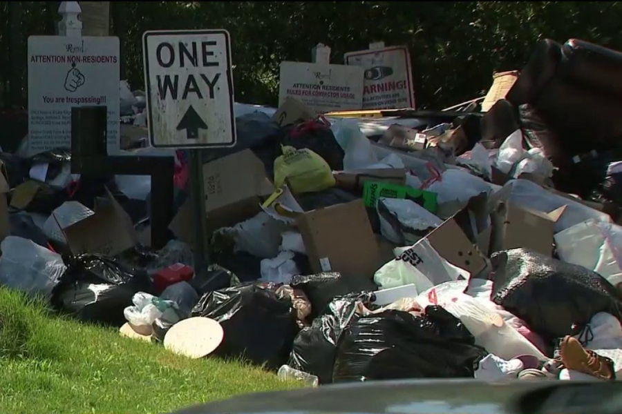 A broken trash compactor has left one Georgia neighborhood piled under garbage