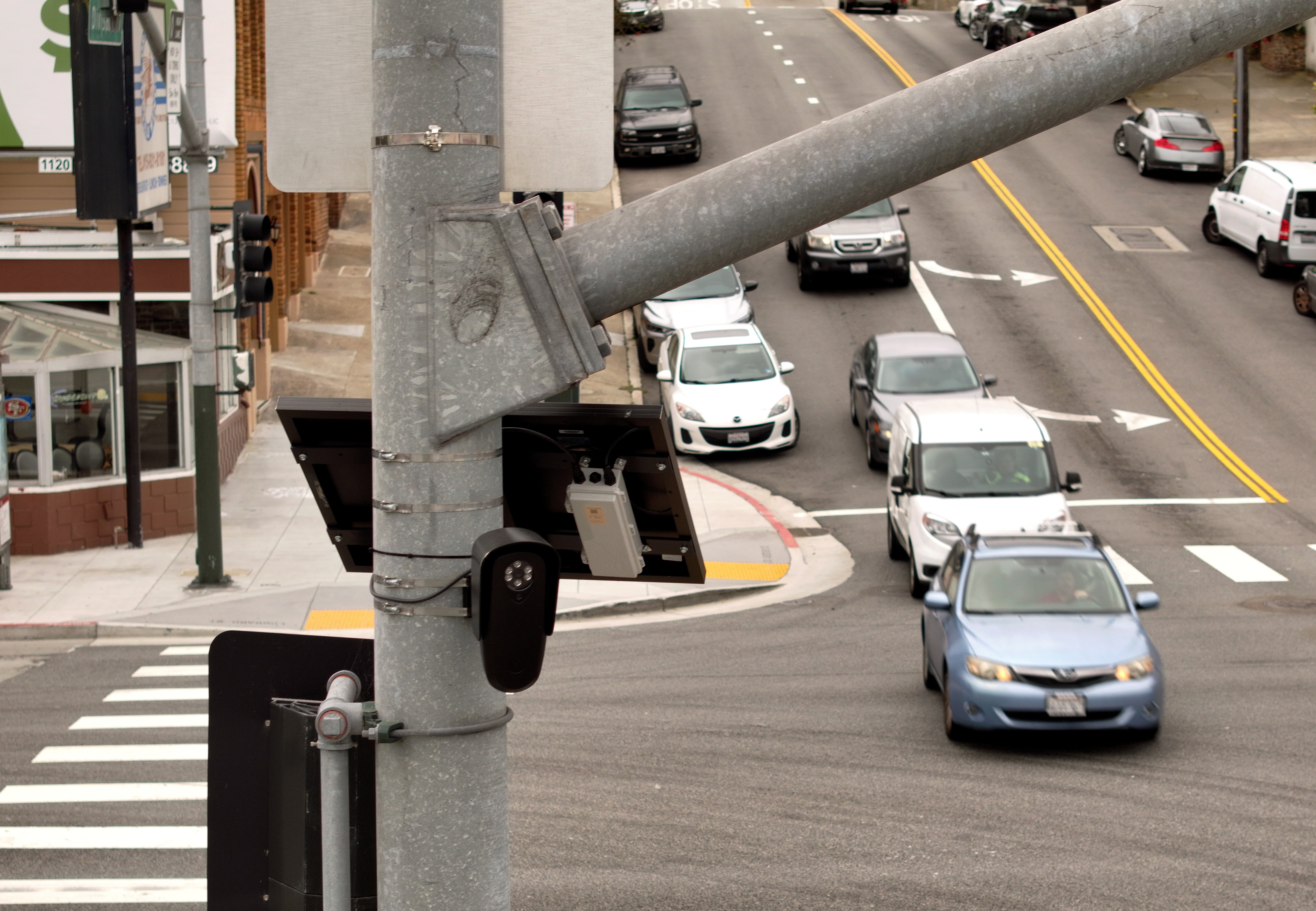 In an aerial view, an automated licence sheet scholar is seen mounted connected a rod successful San Francisco