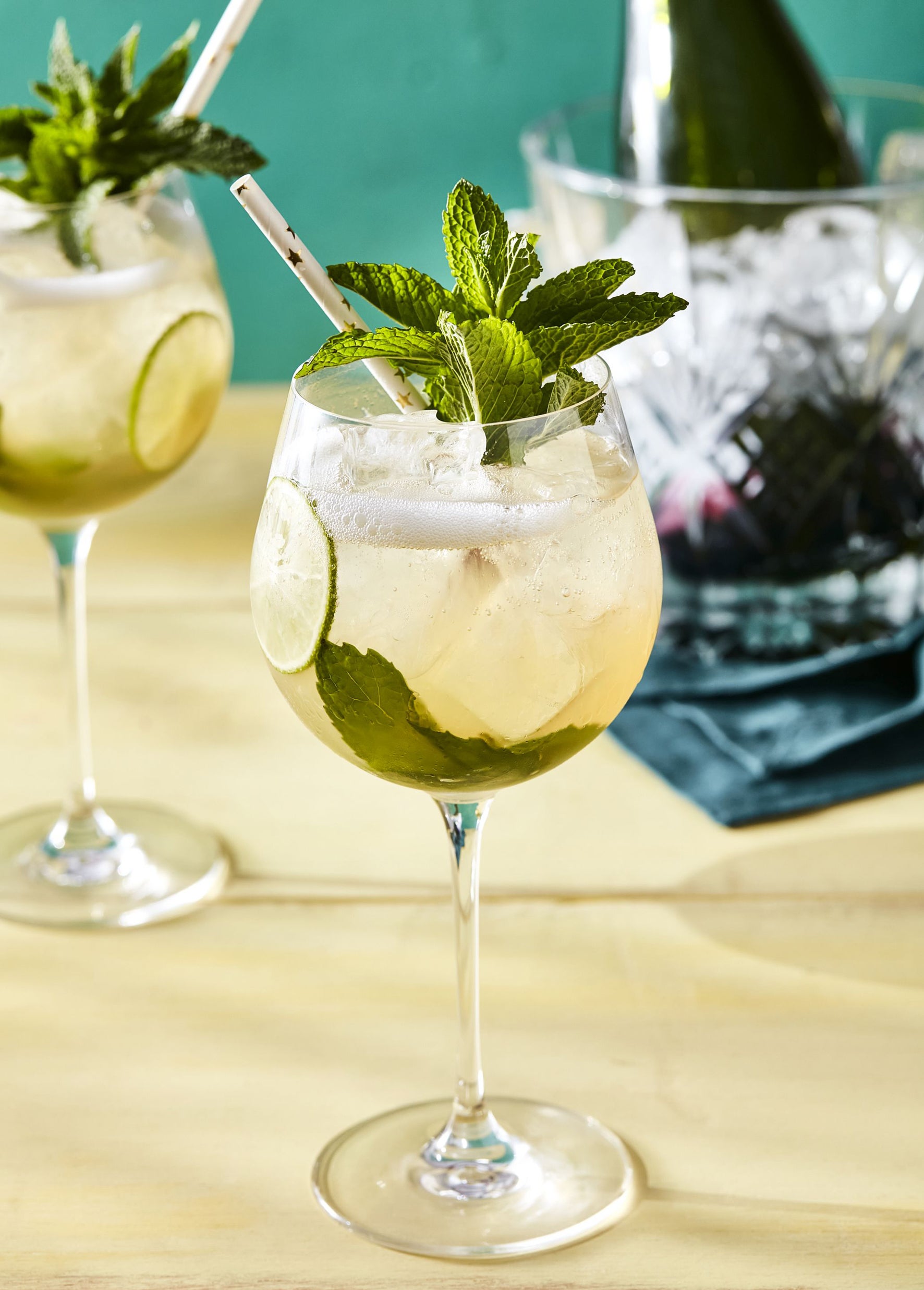 Elderflower season in a glass with prosecco, lime and mint to keep it company