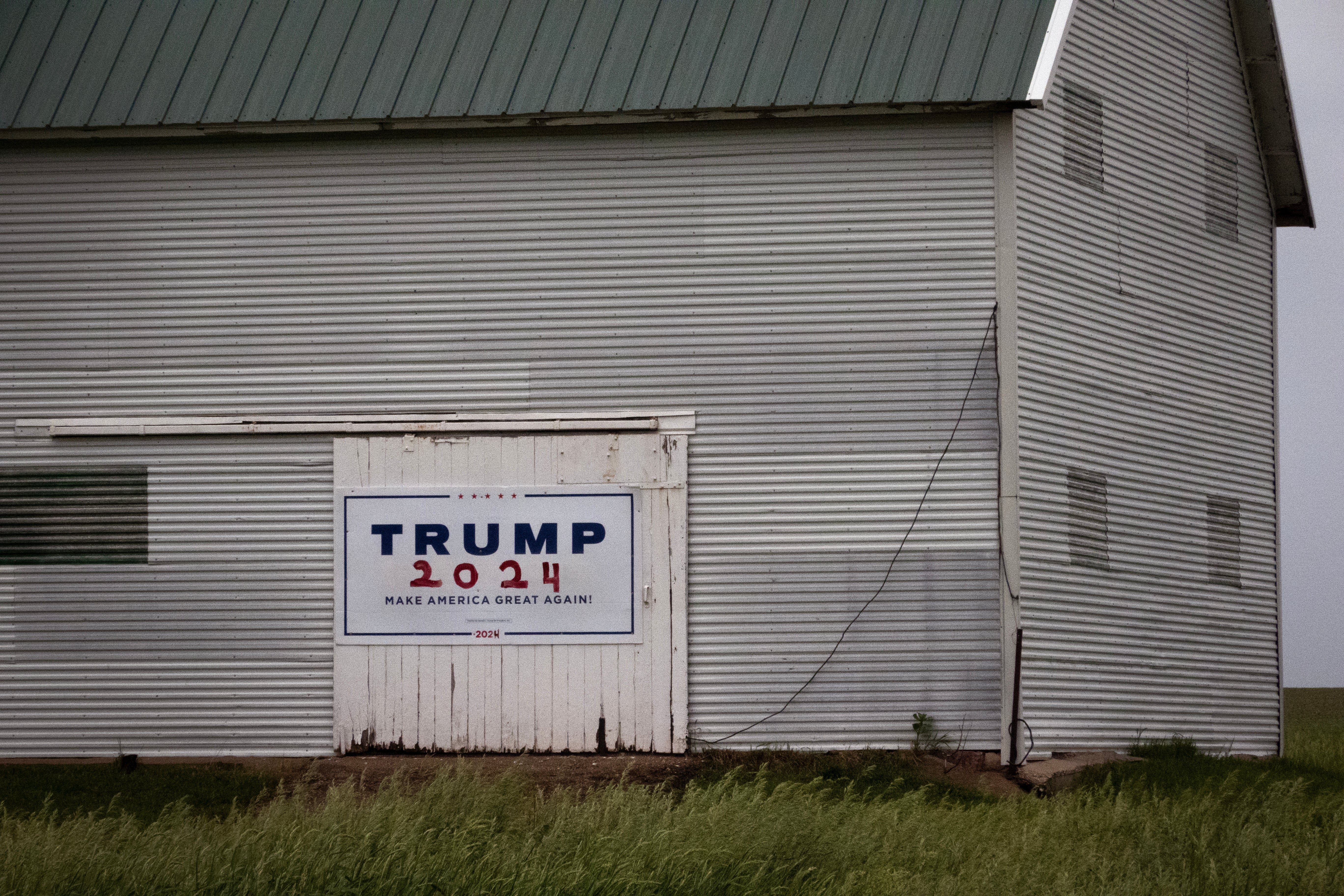 A banner from U.S. President Donald Trump's 2024 run hangs connected a barn doorway connected May 30, 2026 successful Sioux Rapids