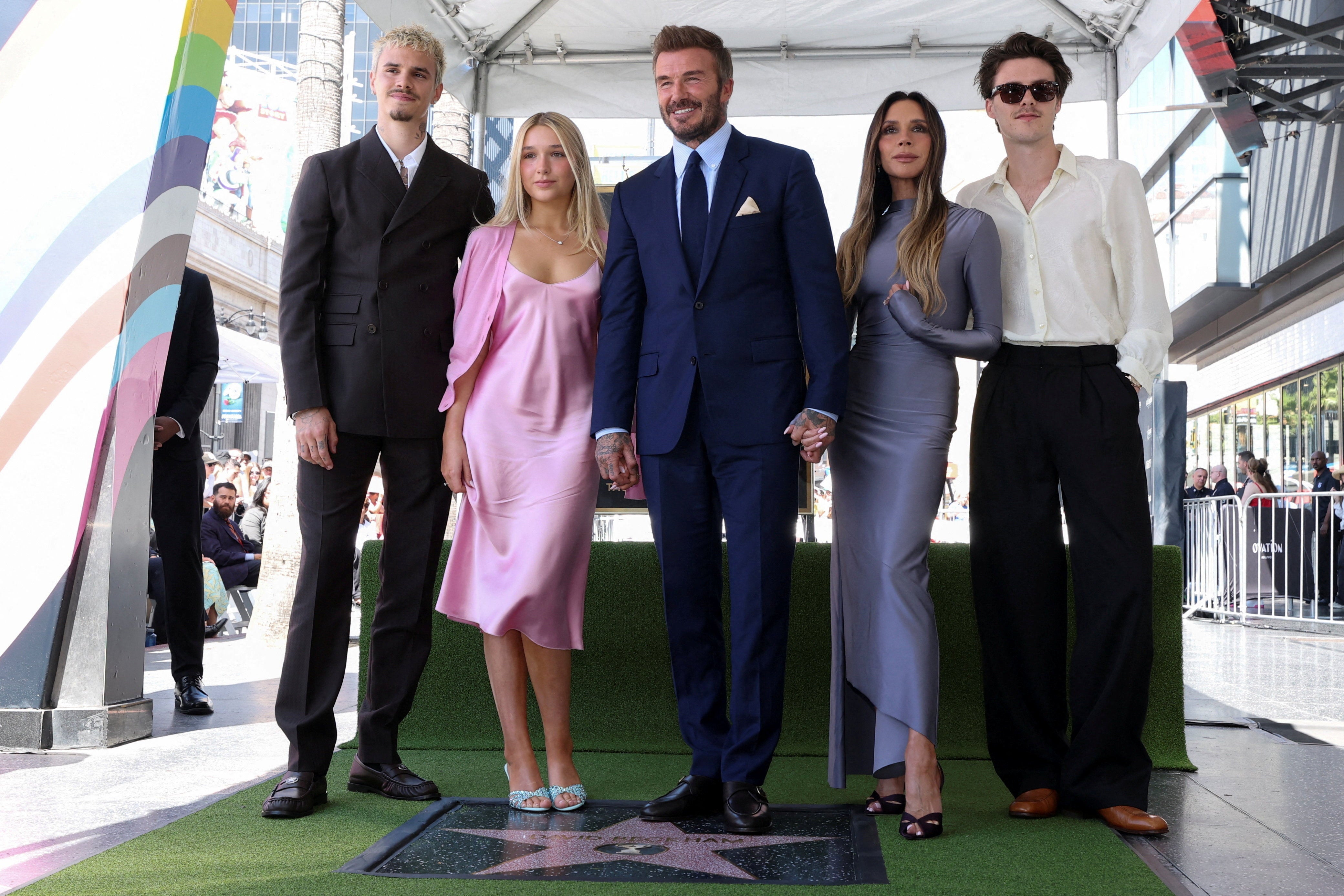 Beckham, centre, with his family – apart from son Brooklyn