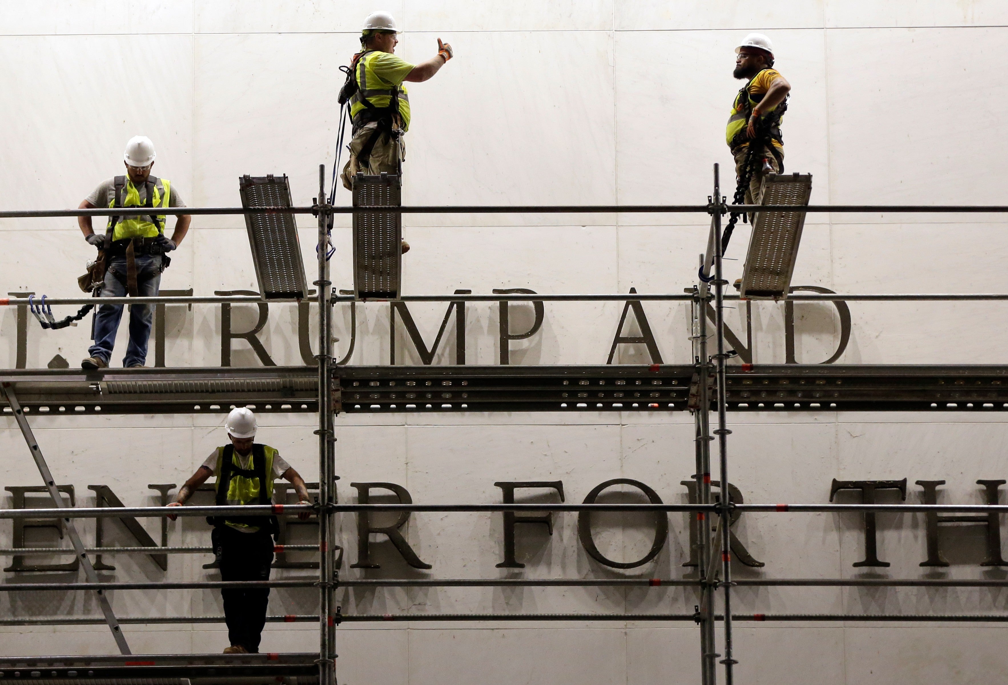 Workers hole to region Trump's sanction from nan Kennedy Center, successful photos