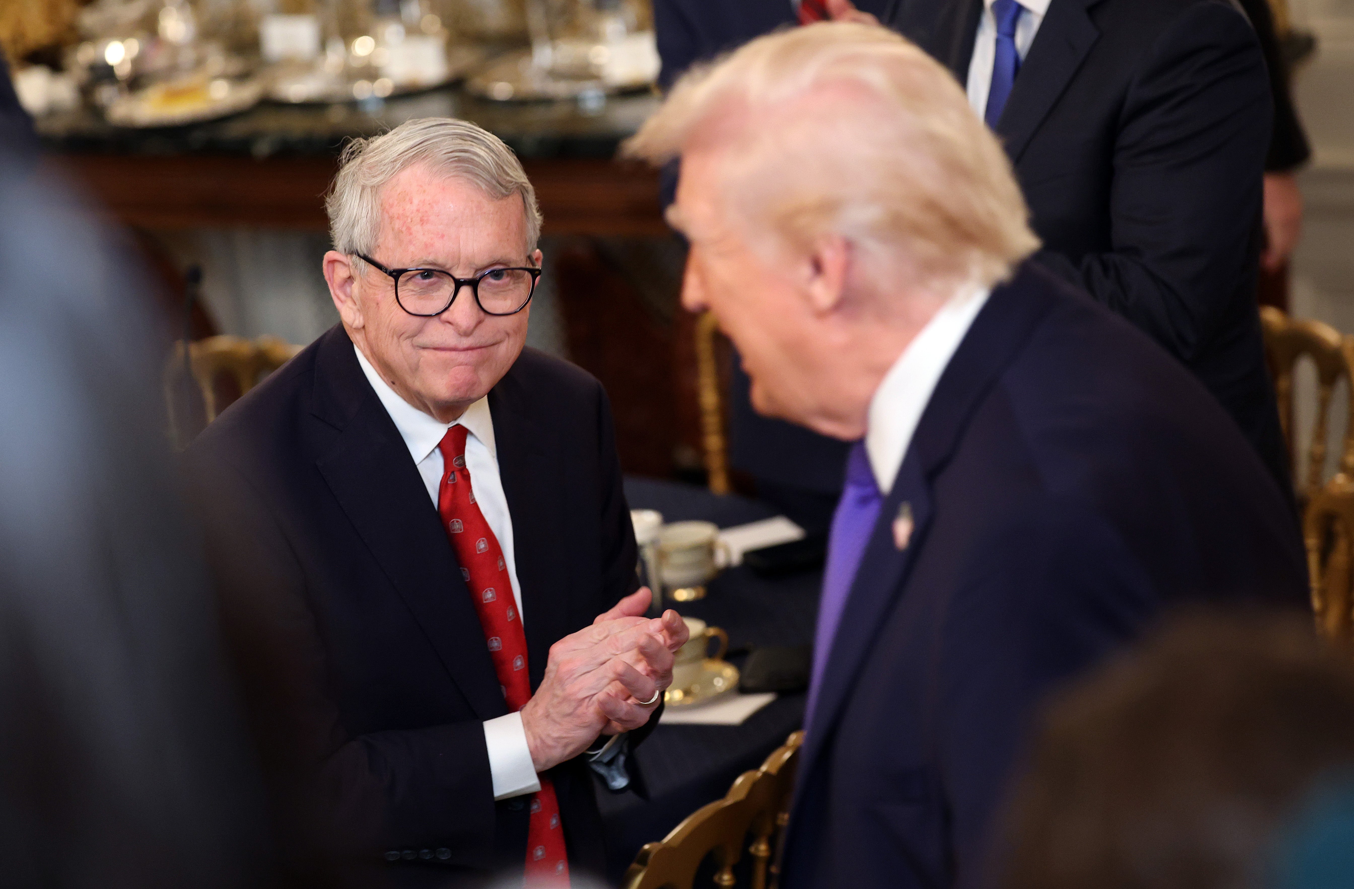 hio Governor Mike DeWine applauds arsenic U.S. President Donald Trump arrives for a moving meal pinch governors successful nan State Dining Room astatine nan White House connected February 20