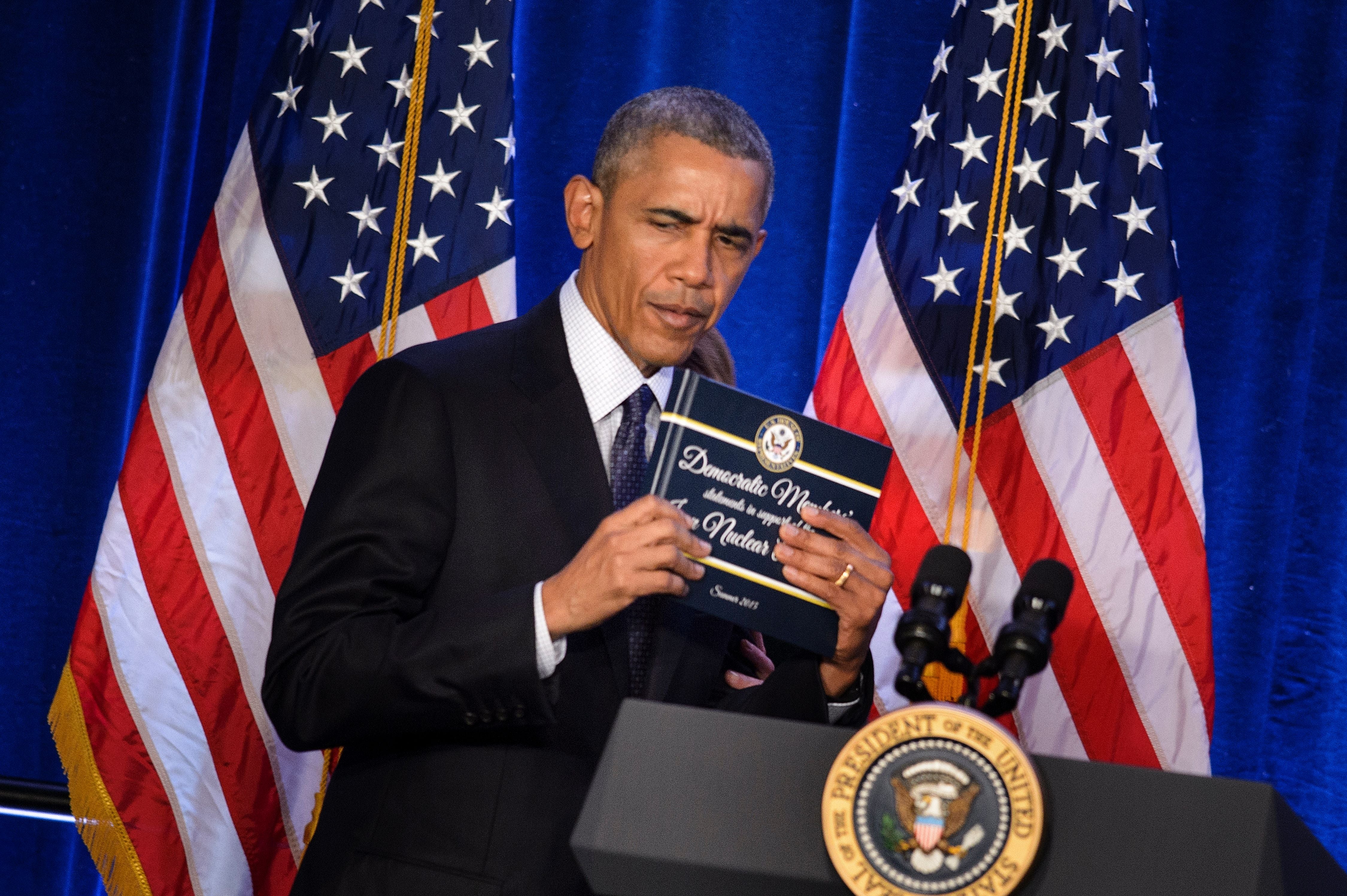 In his 2015 tweet, Trump heavy criticized nan Iran atomic woody signed during Obama's 2nd term. Pictured here, Obama holds a transcript of nan Iran atomic statement presented to him by House Minority Leader Nancy Pelosi connected January 28, 2016