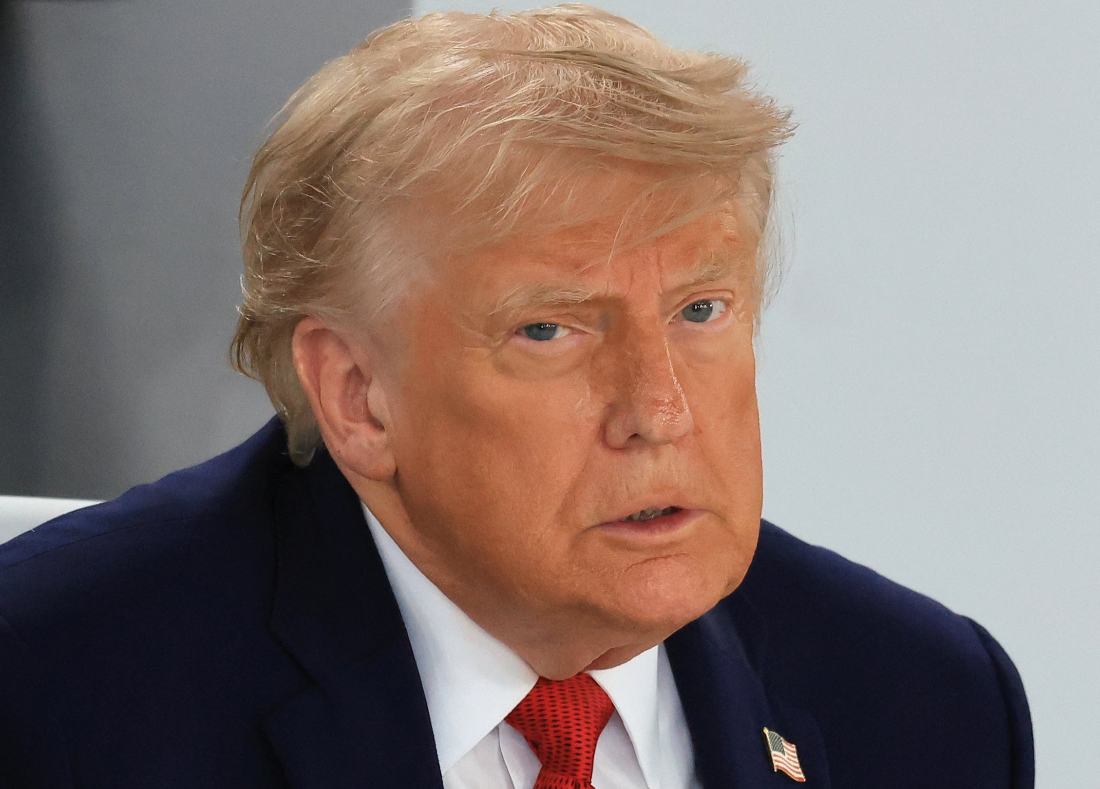 President Donald Trump reacts during a moving luncheon gathering of G7 members, partner countries, and artificial intelligence business leaders arsenic portion of nan G7 summit, successful Evian, eastbound France, connected June 17