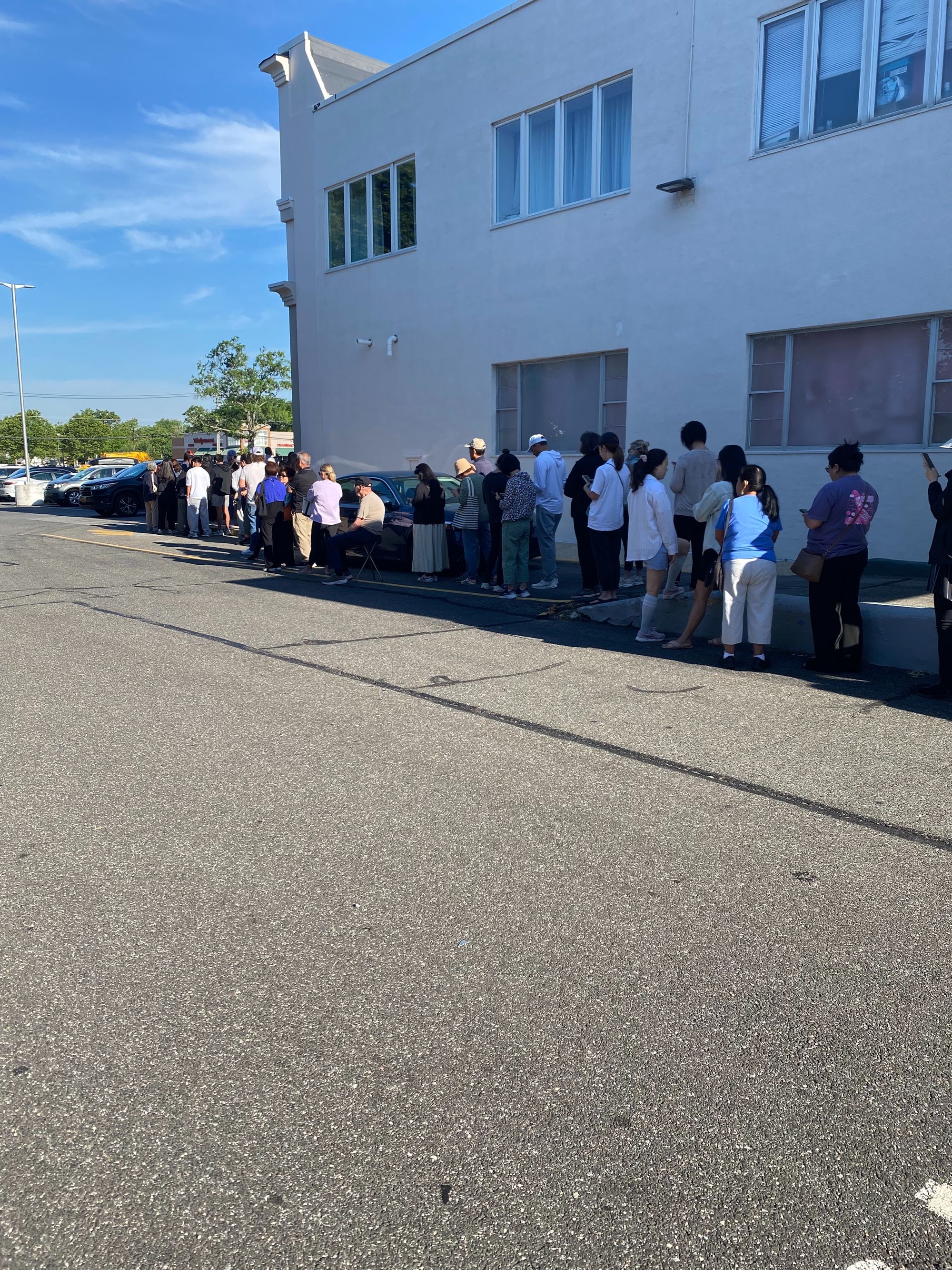 Trader Joe’s shoppers stood in the shade as they waited for the doors to open at 8.a.m.