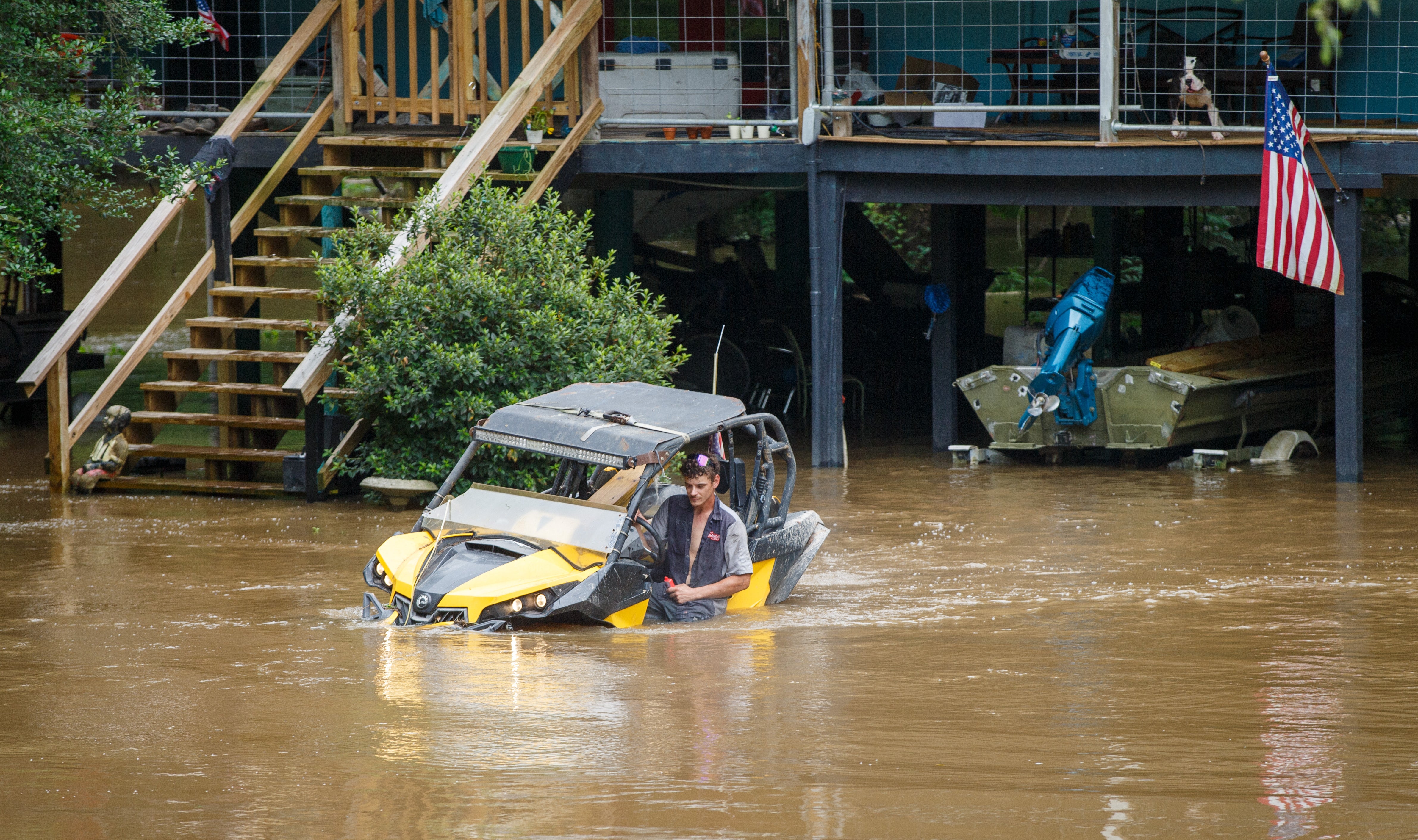 Dalton Saacks moves a mud buggy from nan rising Tchefuncte River up of Tropical Storm Arthur adjacent Folsom, La
