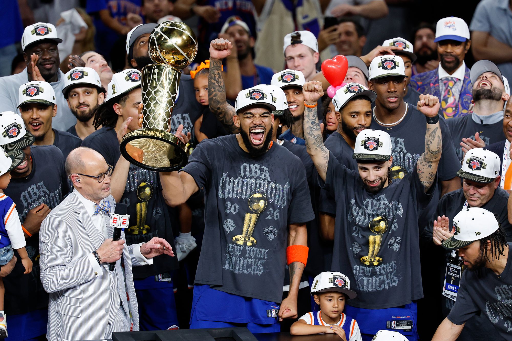 The New York Knicks observe pinch nan Larry O'Brien Championship Trophy aft their triumph against nan San Antonio Spurs successful Game Five of nan 2026 NBA Finals