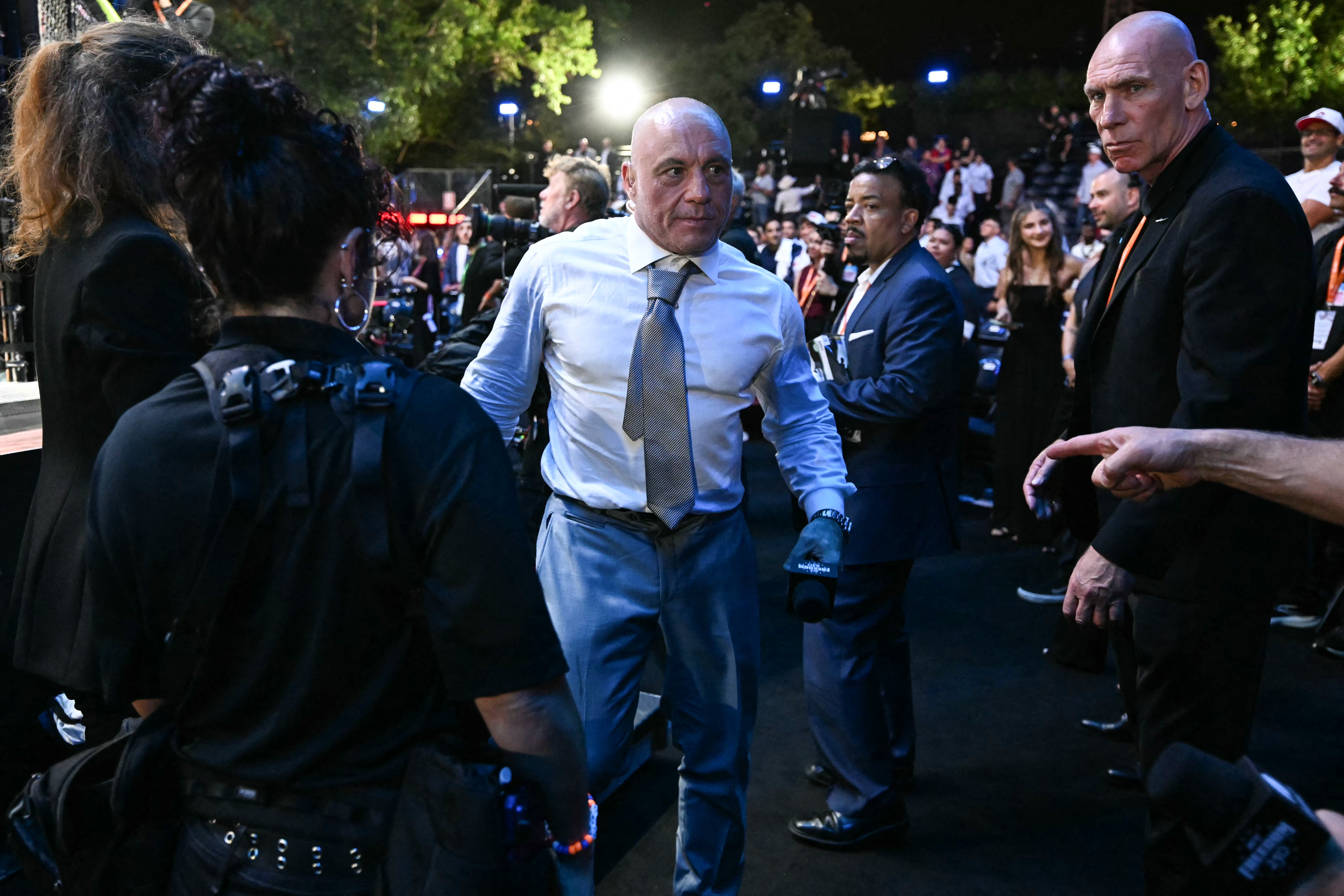 Rogan endorsed Trump successful nan 2024 election, but since past has criticized respective of his awesome argumentation initiatives, including his migration crackdown. Pictured here, nan comedian attends Trump's UFC Freedom 250 arena astatine nan White House connected June 15
