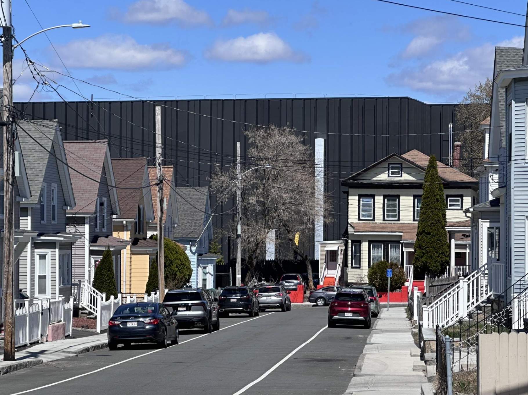 The achromatic exterior walls of a Markley Group information halfway towers complete adjacent homes successful Lowell, Massachusetts.