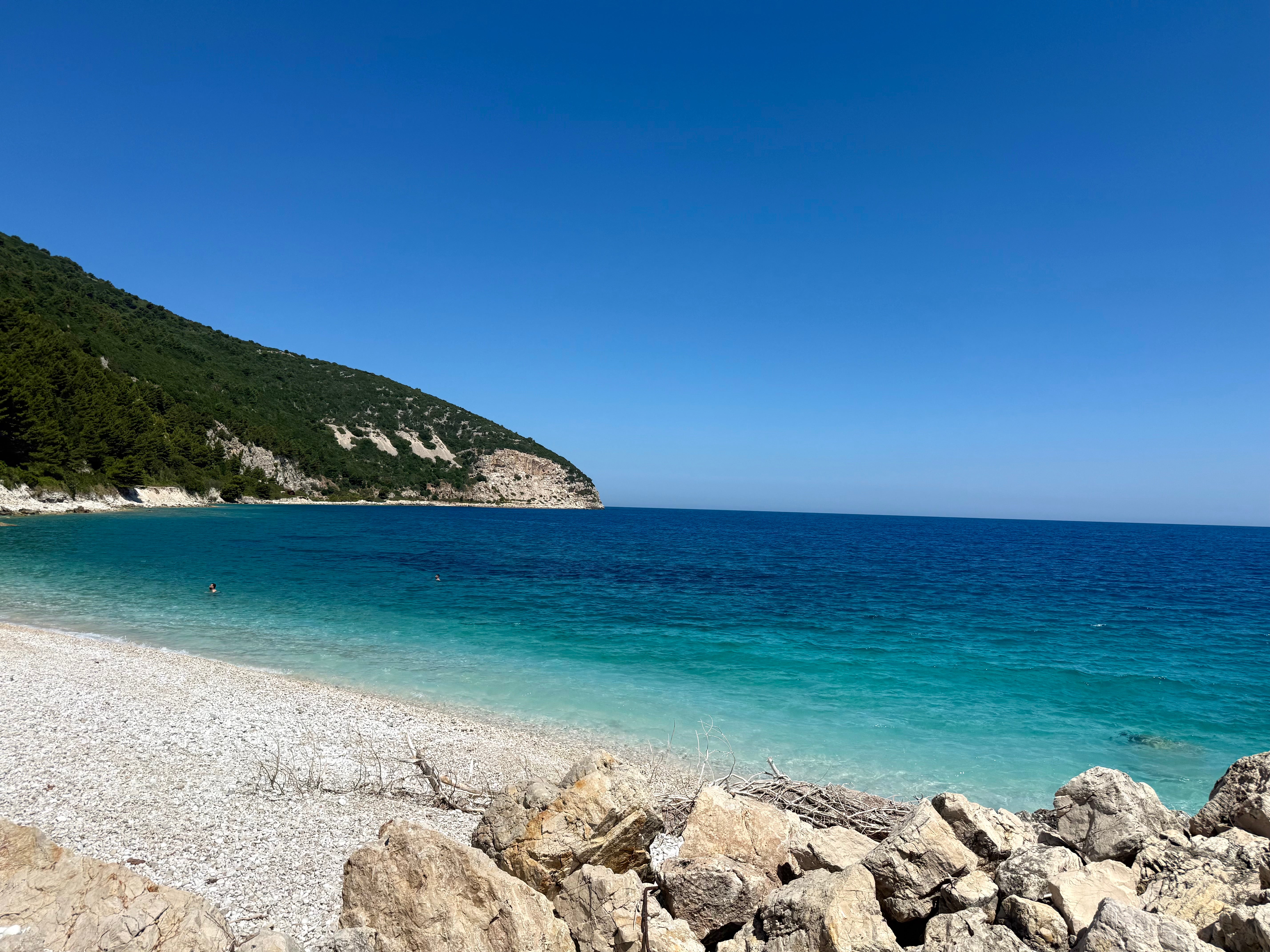 The rocky shoreline of Sazan Island