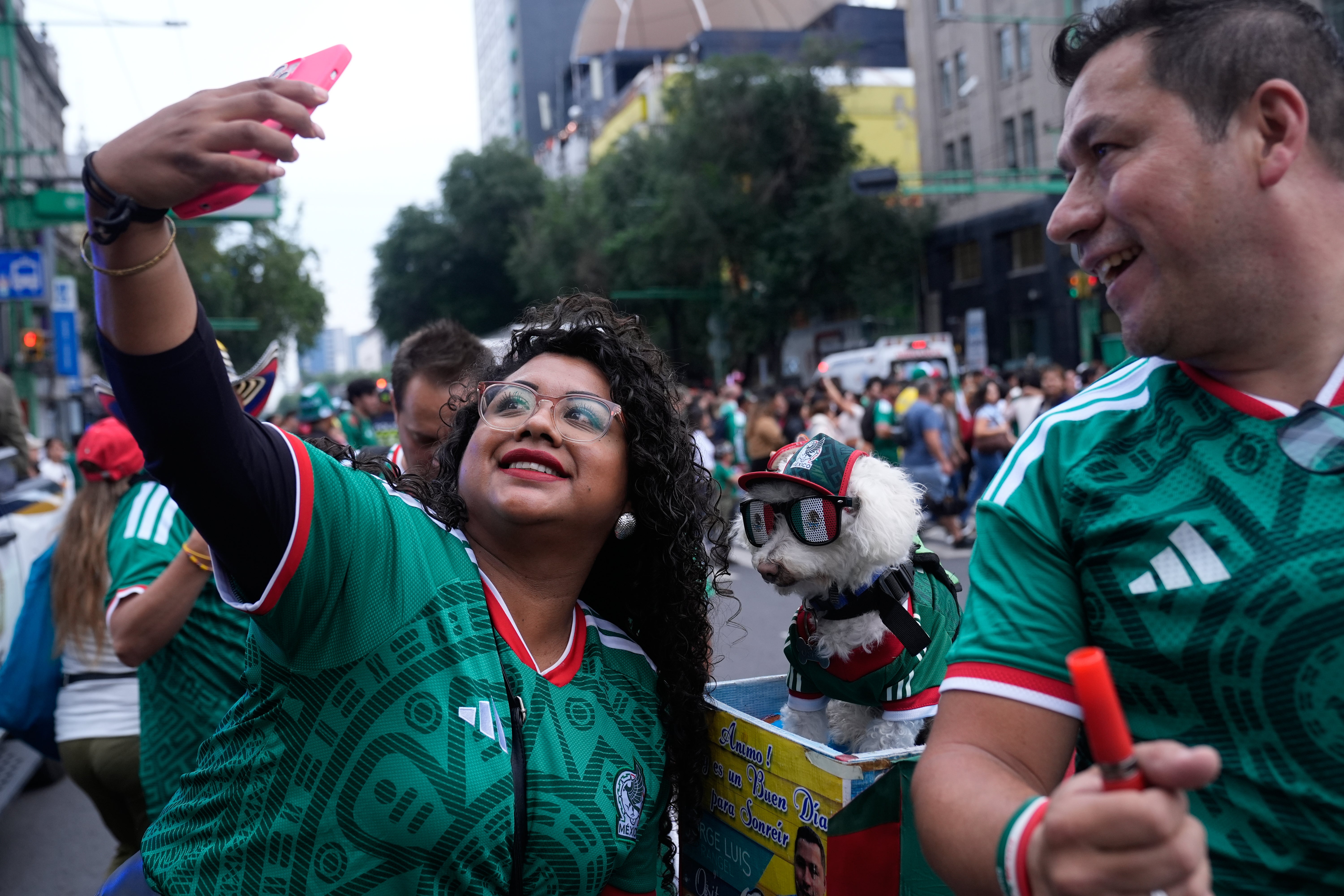 As thousands of fans streamed toward nan stadium past week for nan tourney opener, galore stopped to threat photos, pet nan canine and station videos online