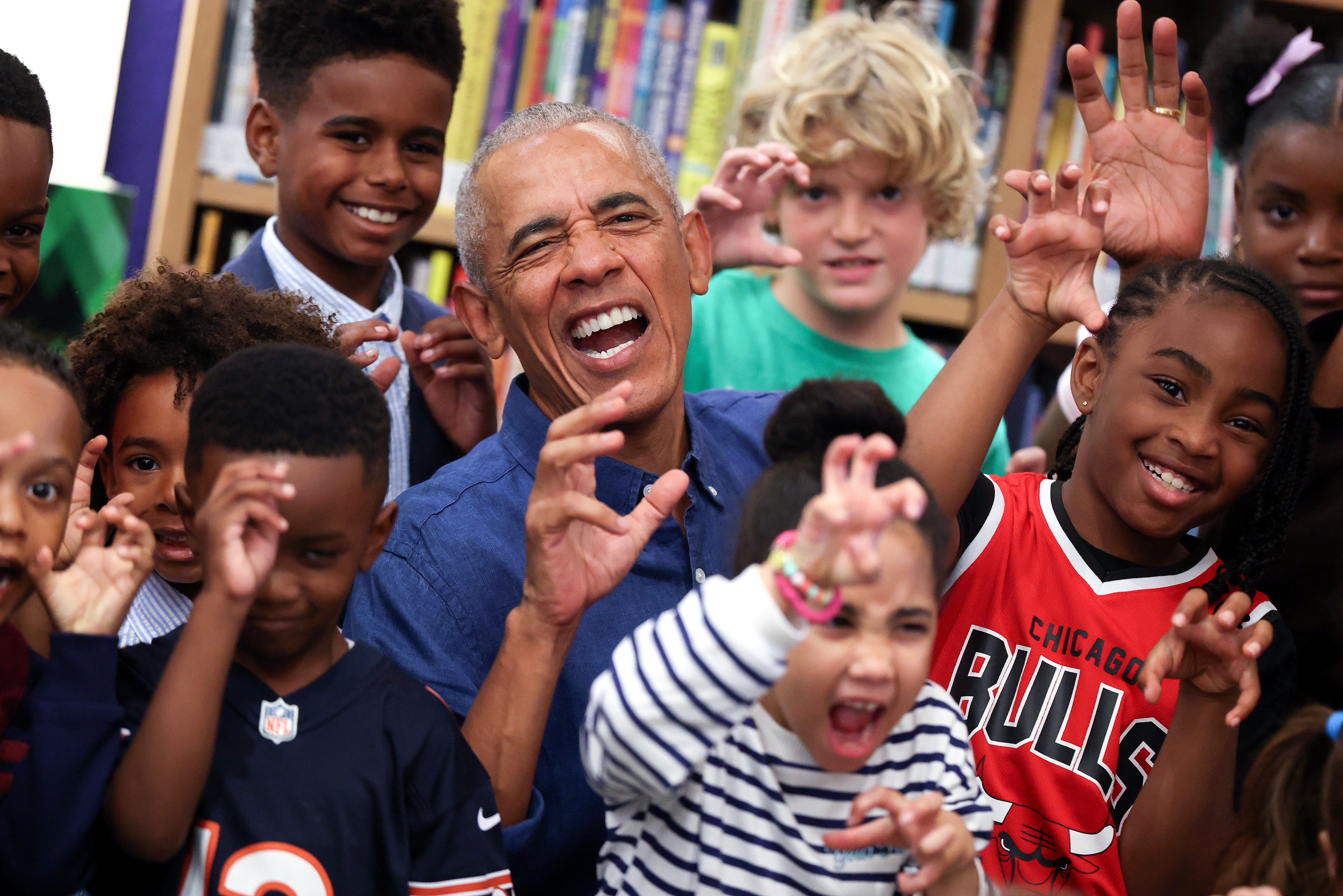 The Obamas delighted 25 schoolchildren astatine nan center's Chicago Public Library branch by reference Maurice Sendak's classical ‘Where nan Wild Things Are’