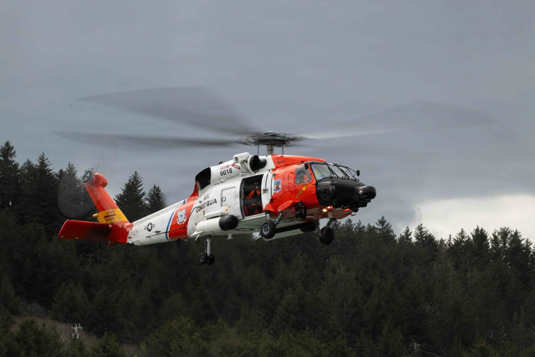 A Coast Guard MH-60 Jayhawk chopper pictured during an arena successful Alaska successful May, 2026