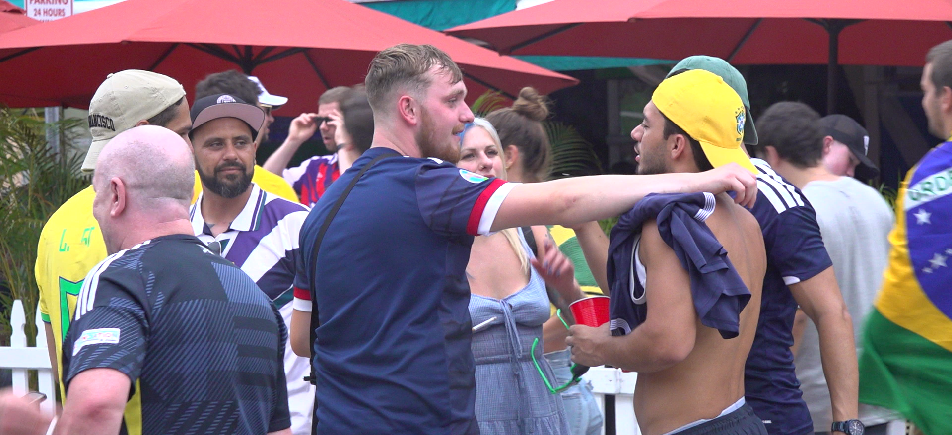 The Scots and Brasilians displayed no animosity between one-another, enjoying cold beers and street football together. (Ryan McDougall/PA)