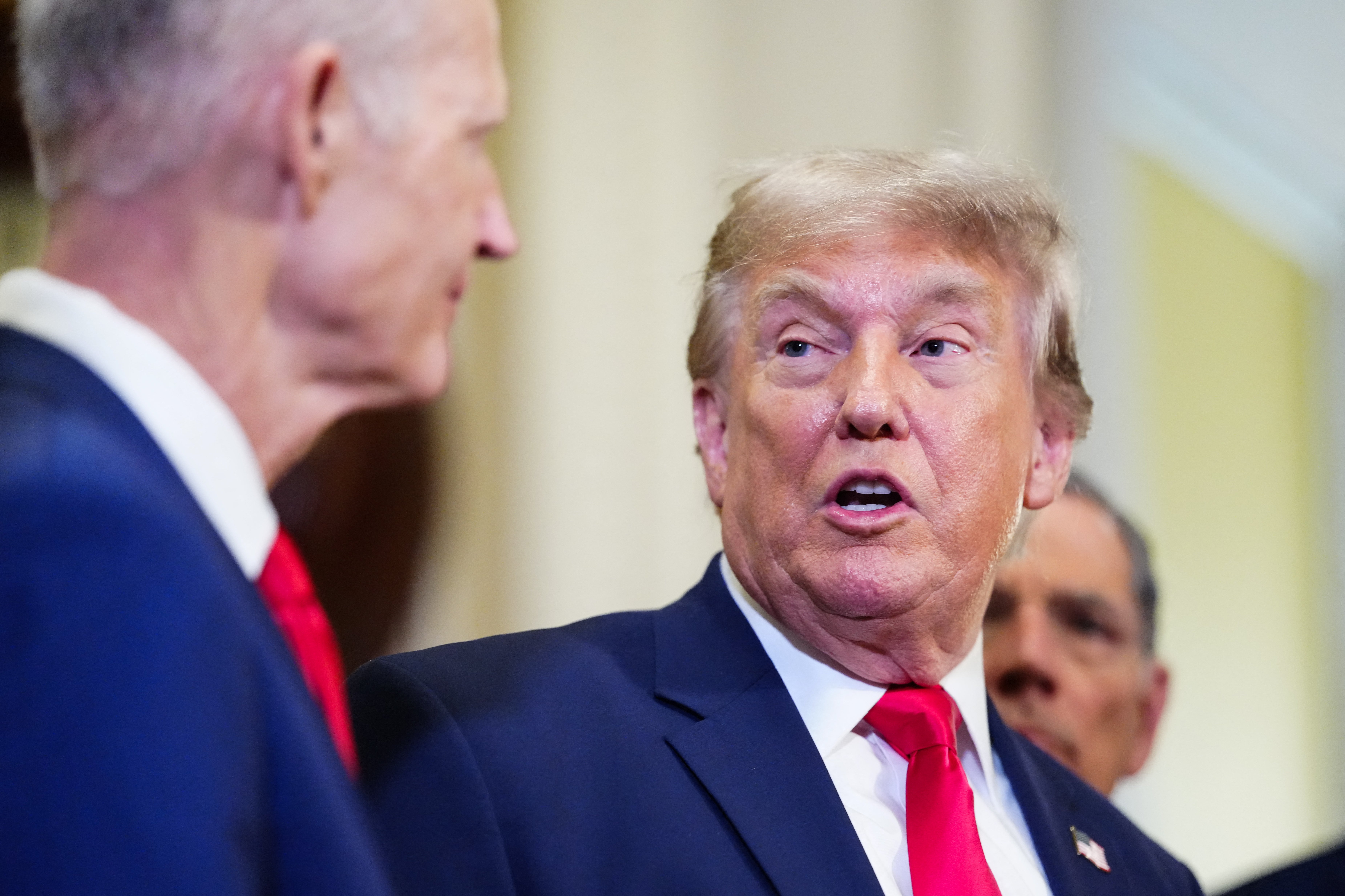 Senator Rick Scott, Republican from Florida, looks connected arsenic President Donald Trump speaks to nan property aft a luncheon gathering pinch Senate Republicans