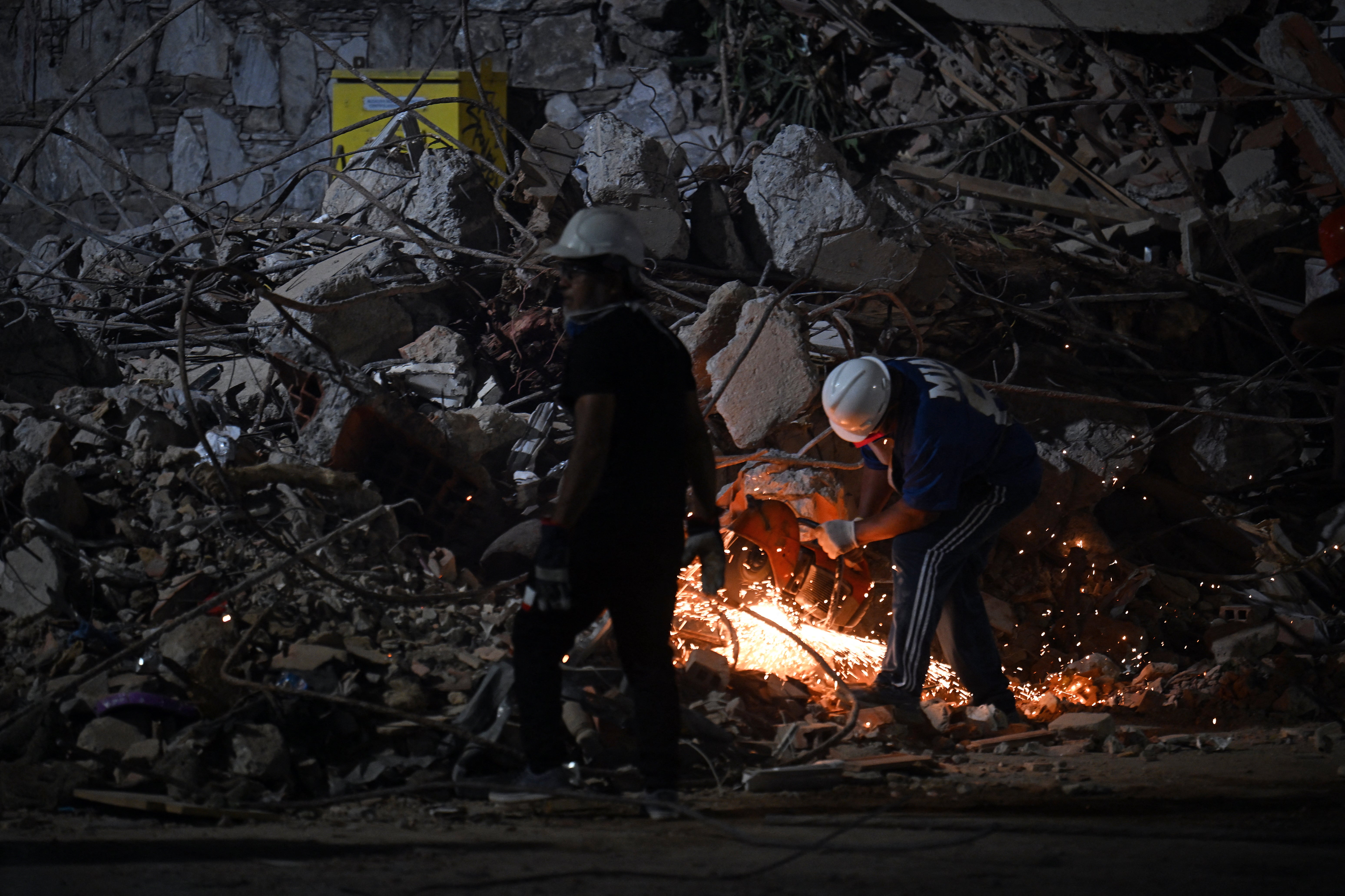 A rescuer cuts nan alloy bars of a collapsed building pinch an perspective grinder successful Caracas connected June 25, 2026, pursuing deadly earthquakes. Using dense instrumentality aliases their bare hands, rescuers and volunteers searched for survivors of nan copy earthquake successful Venezuela, which has officially near 589 dormant and, according to estimates, thousands missing.