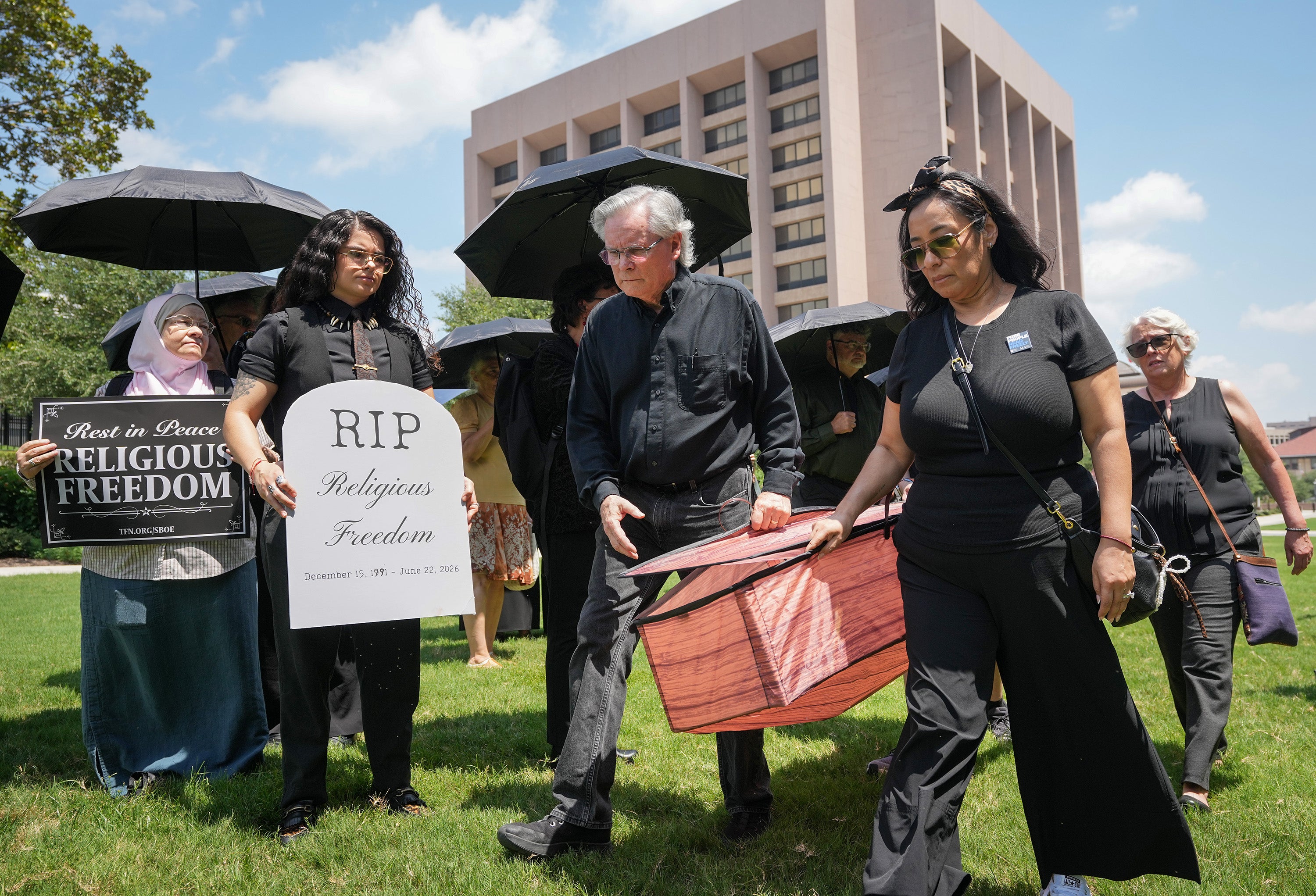 People participate successful an interfaith funeral-themed protestation successful Austin, Texas, past month. The Texas committee of acquisition has controversially voted to require Bible stories to beryllium taught from kindergarten done to nan last twelvemonth of precocious school