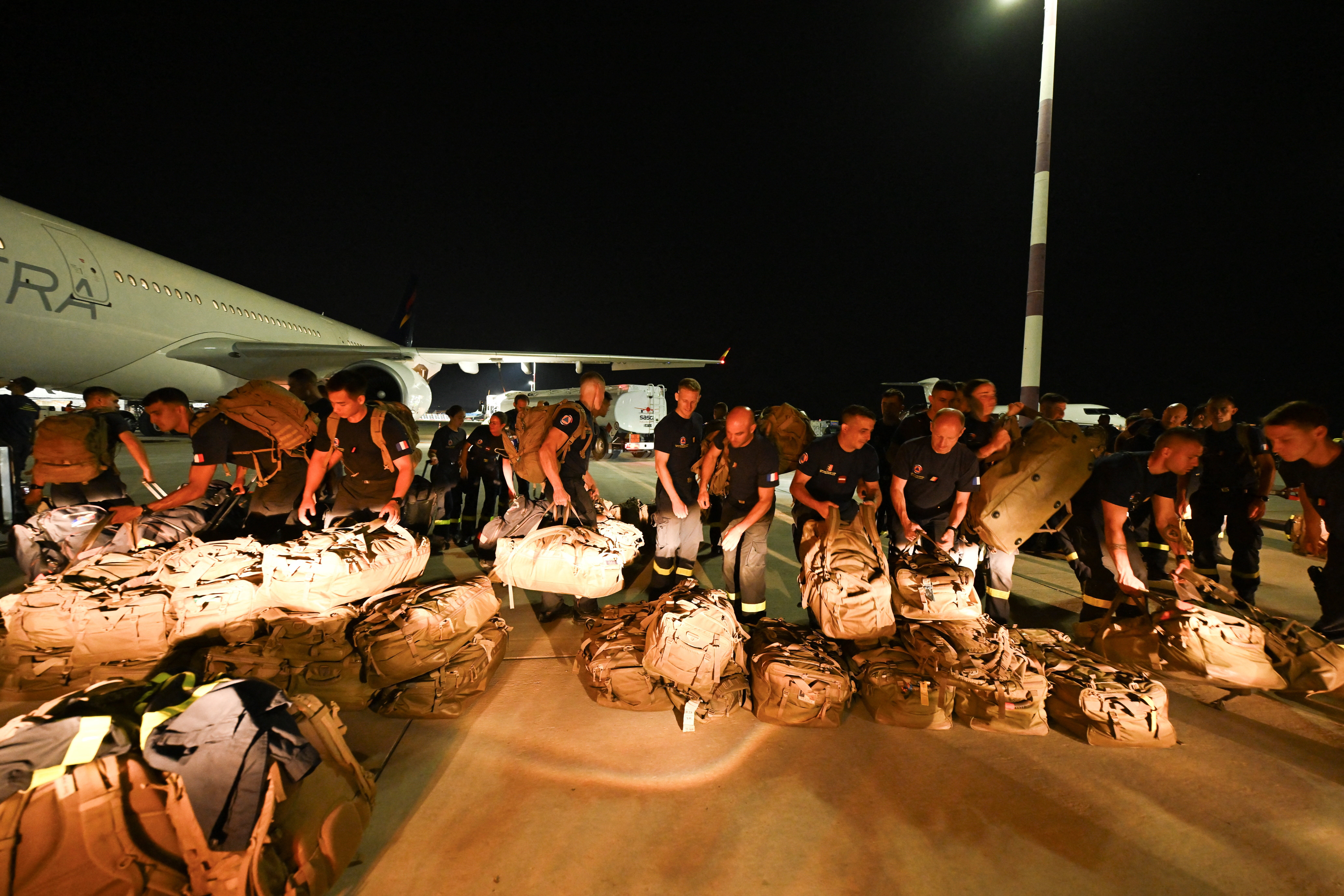 French officers of nan 7e Regiment d'Instruction et d'Intervention de la Securite Civile (7e RIISC - The 7th Civil Security Training and Response Regiment) hole their shipment earlier flying to Venezuela to supply thief aft 2 earthquakes deed nan country, astatine nan Marseille Provence Airport successful Marignane, confederate France, connected June 27, 2026.