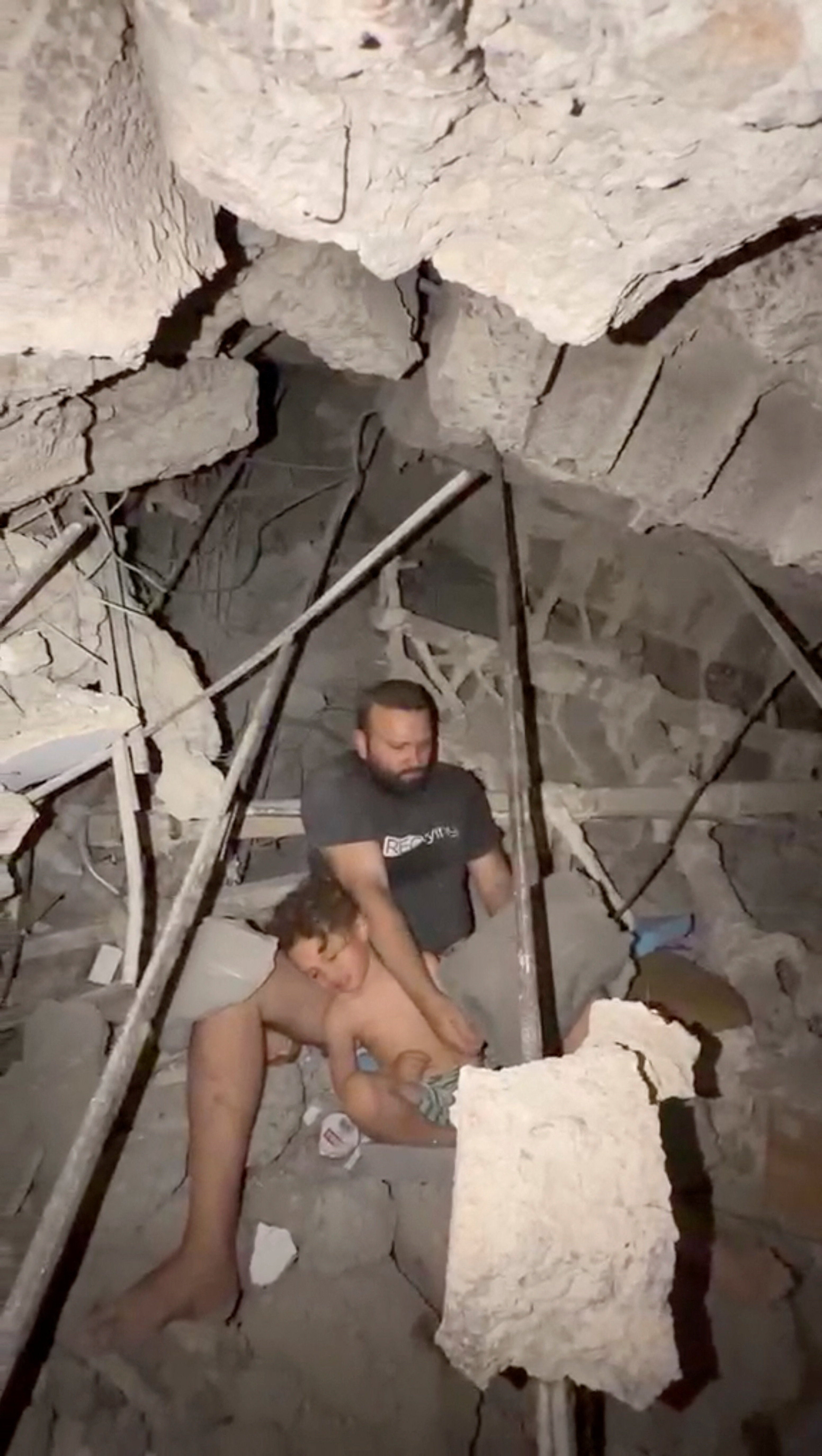 Jofram Gallipoli and his boy beryllium nether nan rubble of building aft earthquakes deed nan country, successful La Guaira, Venezuela, June 25, 2026,