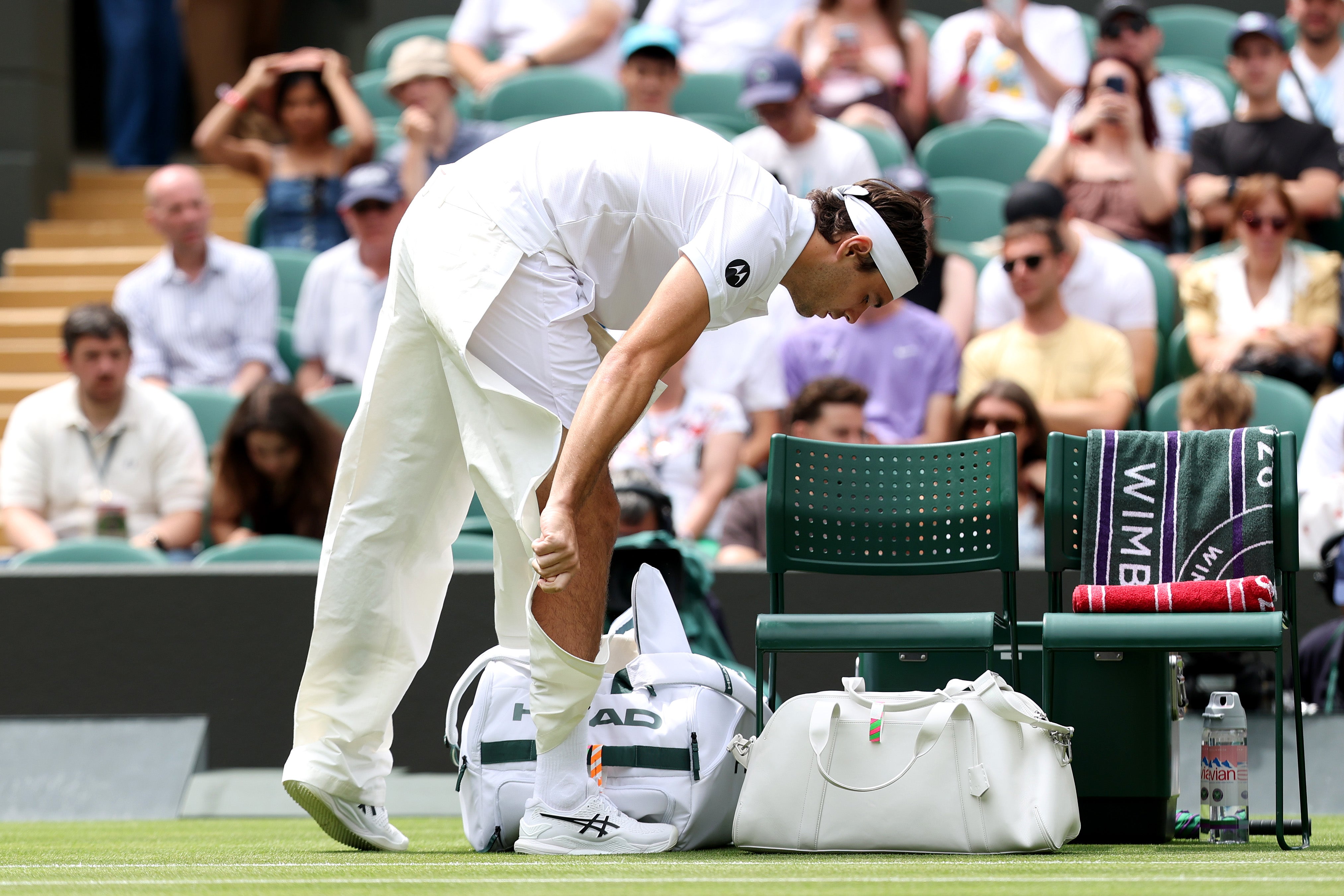 Fritz rips open his trousers ahead of his match against Dusan Lajovic