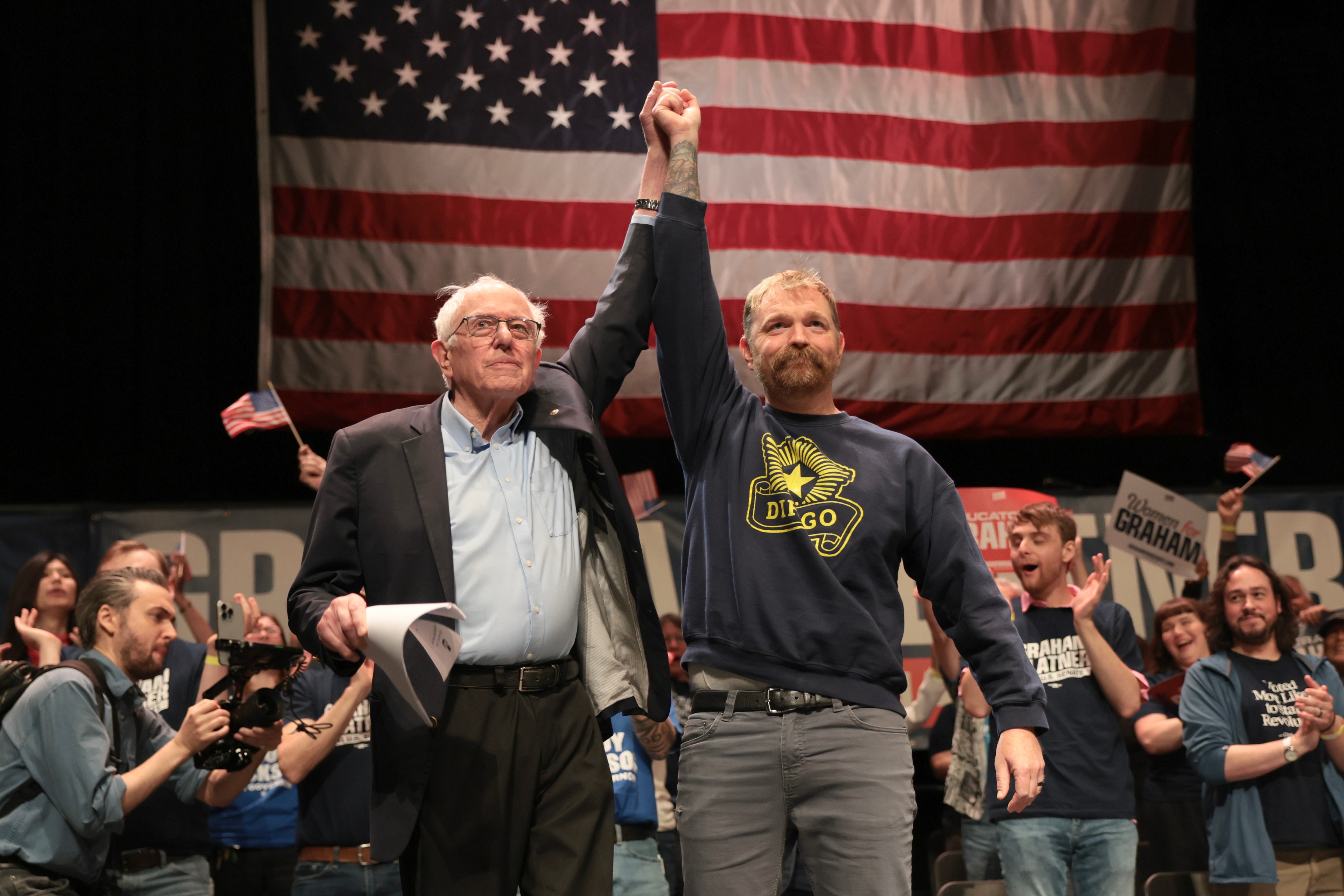 Sen. Bernie Sanders (I-VT) and Democratic U.S. Senate campaigner Graham Platner guidelines together during a “Fighting Oligarchy” circuit extremity astatine nan Collins Center for nan Arts connected nan University of Maine campus
