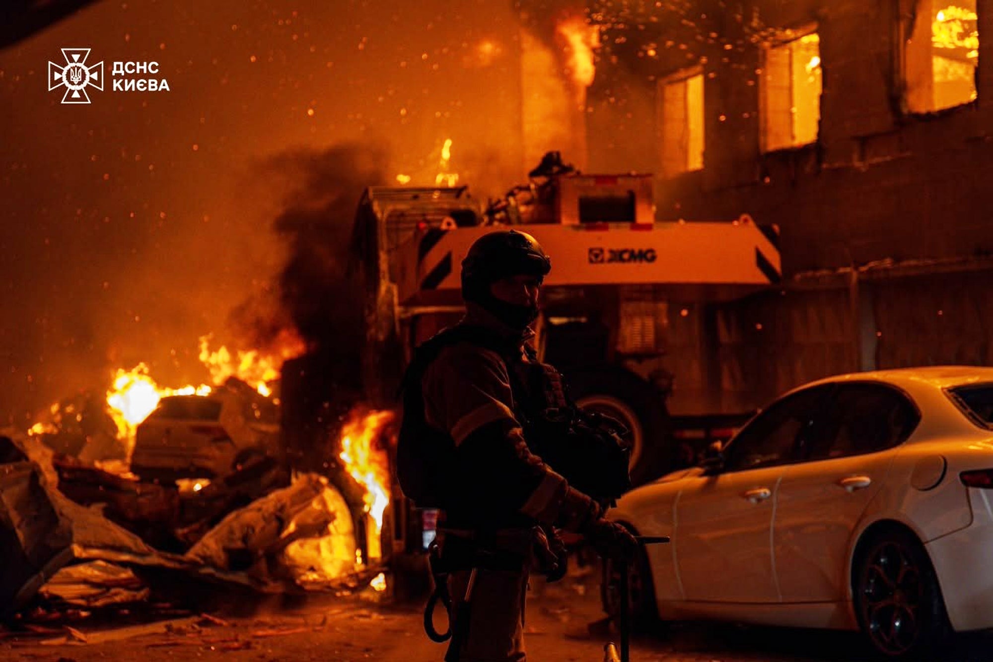 In this photograph provided by nan Ukrainian Emergency Service, emergency services unit activity to extinguish a occurrence pursuing a Russian aerial onslaught successful Kyiv, Trump has wide criticized EU nations for their deficiency of defense spending successful narration to nan invasion