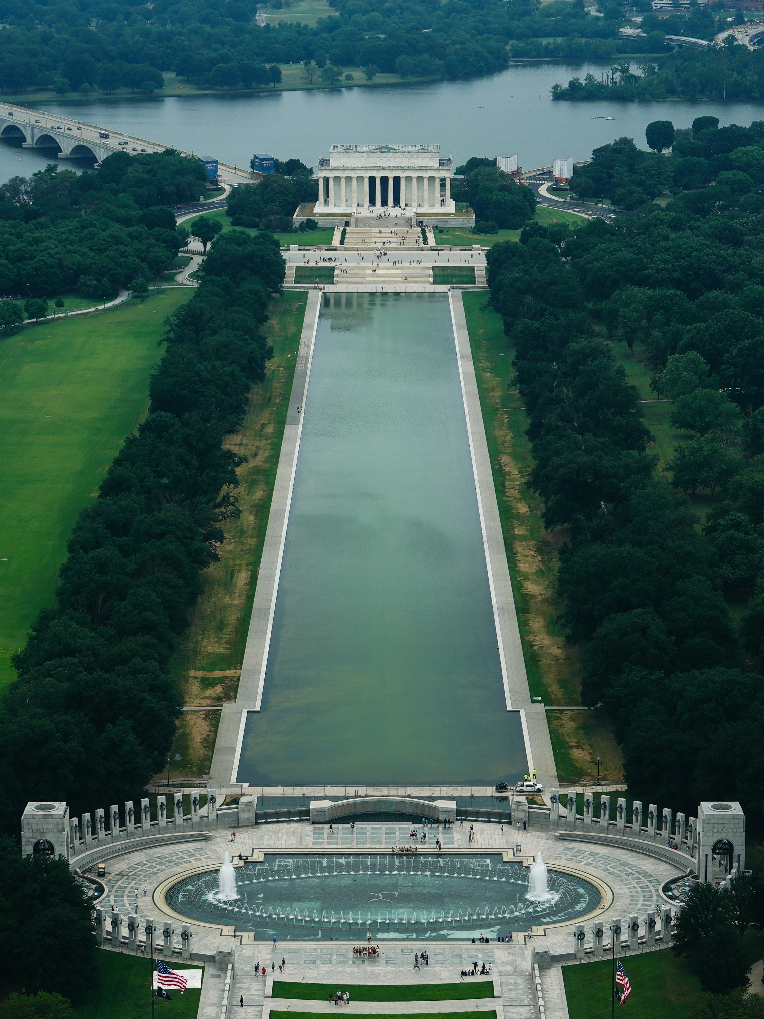 The Lincoln Memorial Reflecting Pool is seen, with algae visible on the bottom covering the 