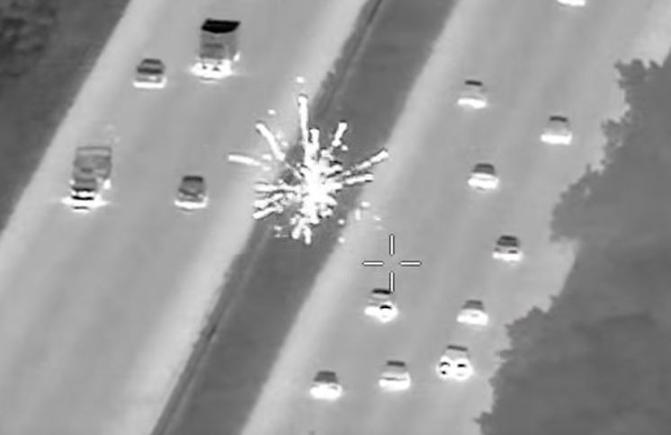 Shocking moment passenger shoots fireworks at cars on Florida highway