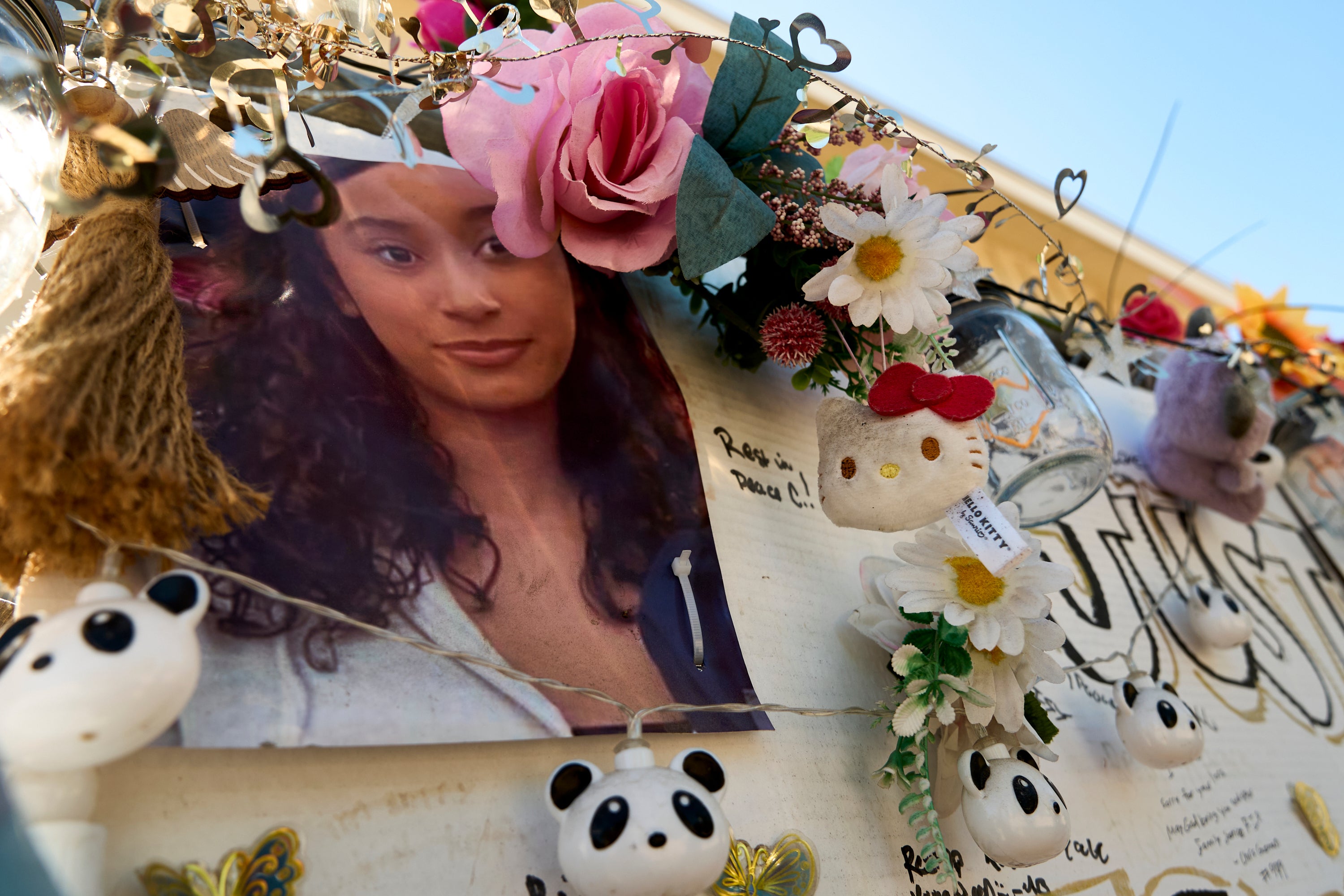 A makeshift memorial for Celeste Rivas Hernandez, whose body was found inside a vehicle owned by singer D4vd, is displayed outside her home in Lake Elsinore
