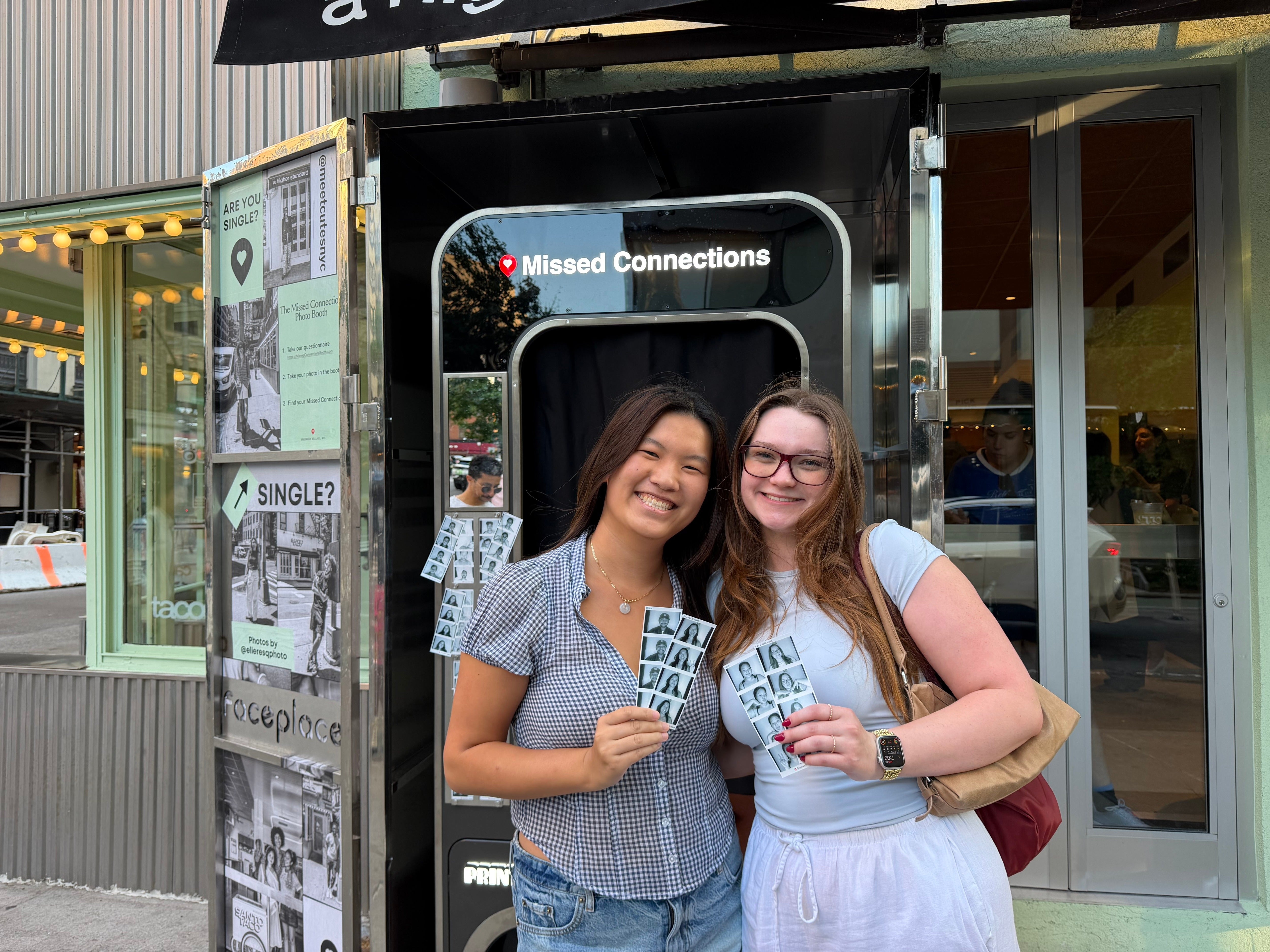 Cassidy (right) pictured with a friend after receiving their matches at the ‘Missed Connections’ photobooth