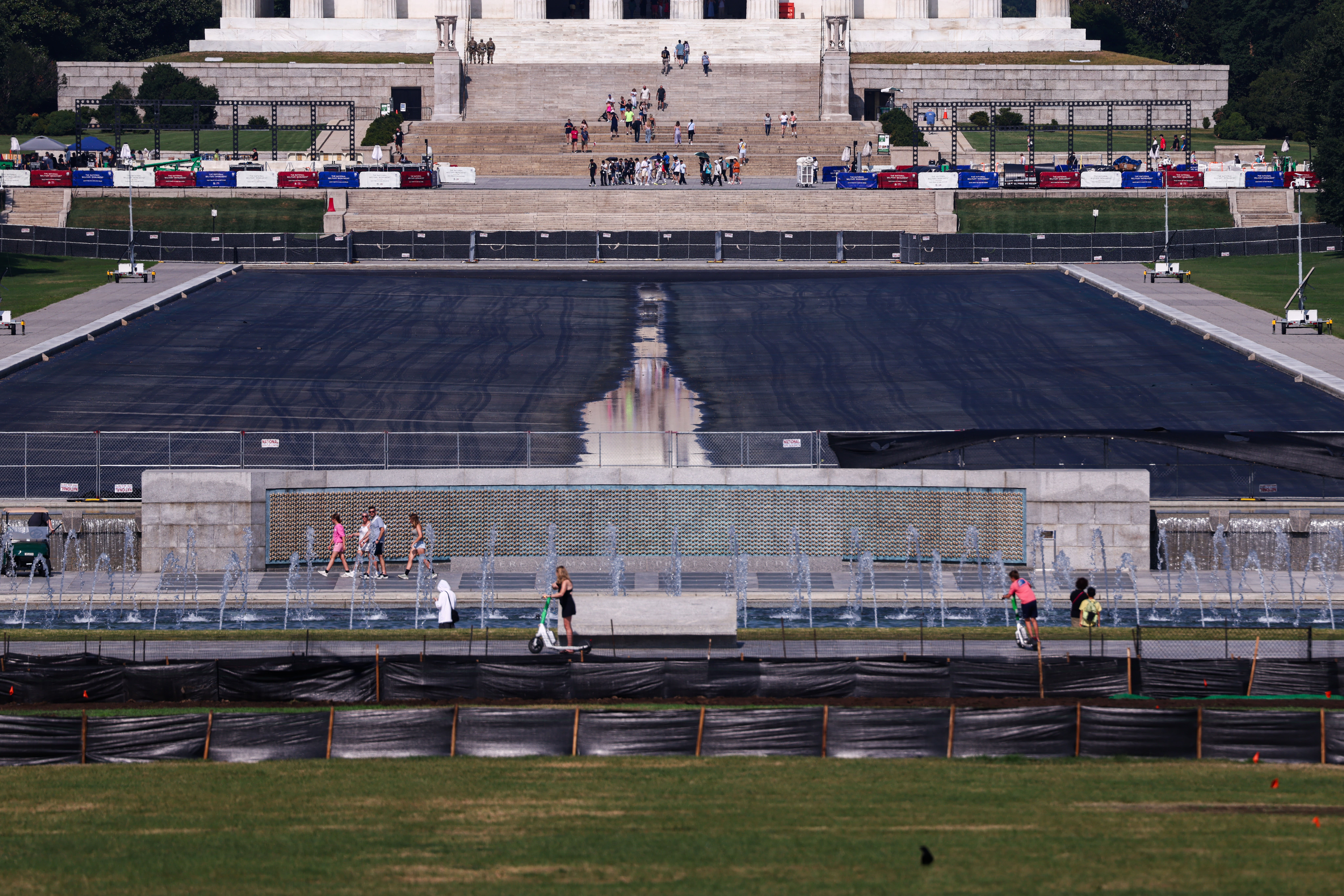 People locomotion past nan drained Reflecting Pool connected nan National Mall connected July 22, 2026 successful Washington, DC.