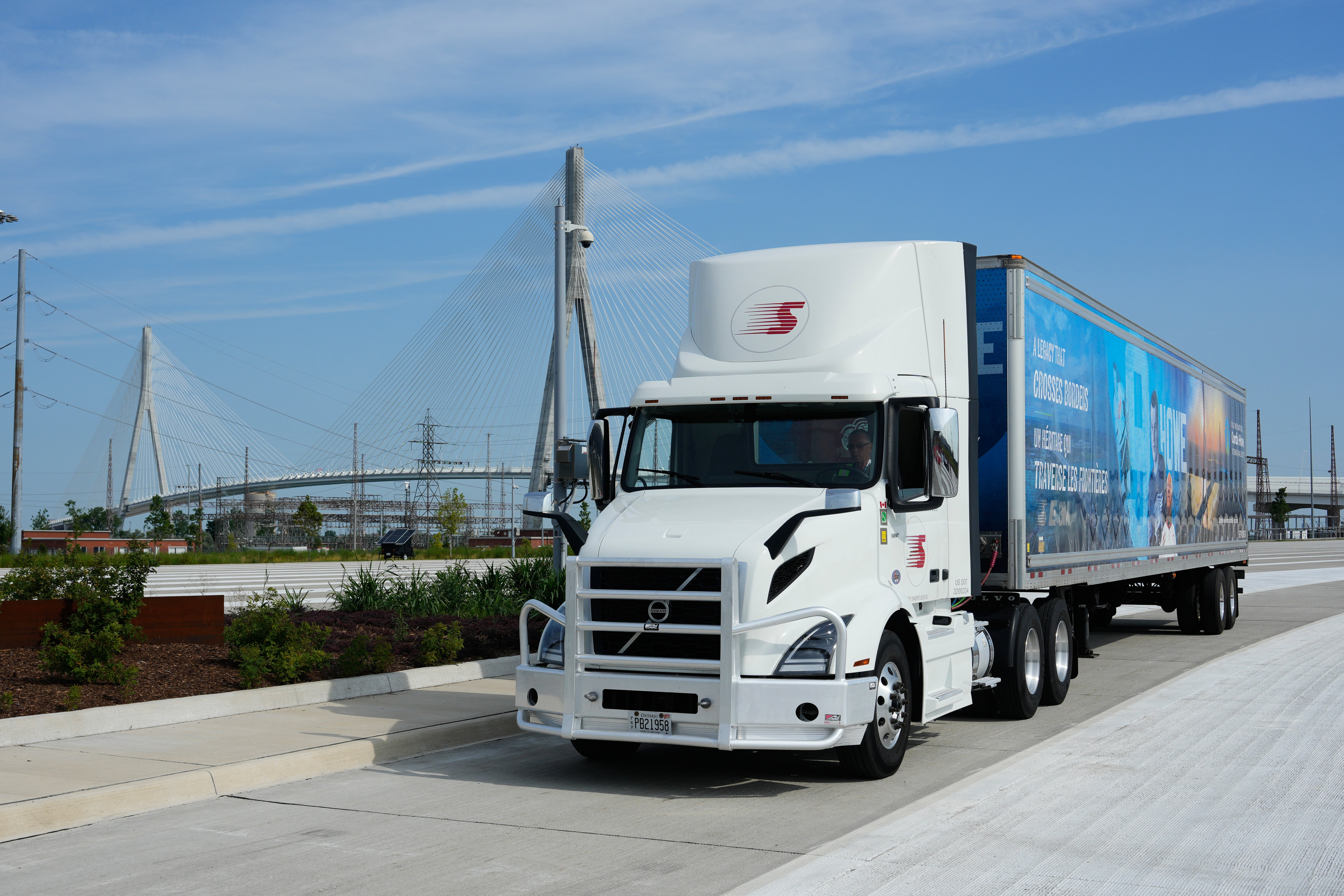 A motortruck is parked during a Canadian ceremony marking nan Gordie Howe International Bridge, which connects Detroit and Windsor, Ontario, connected Friday, July 24