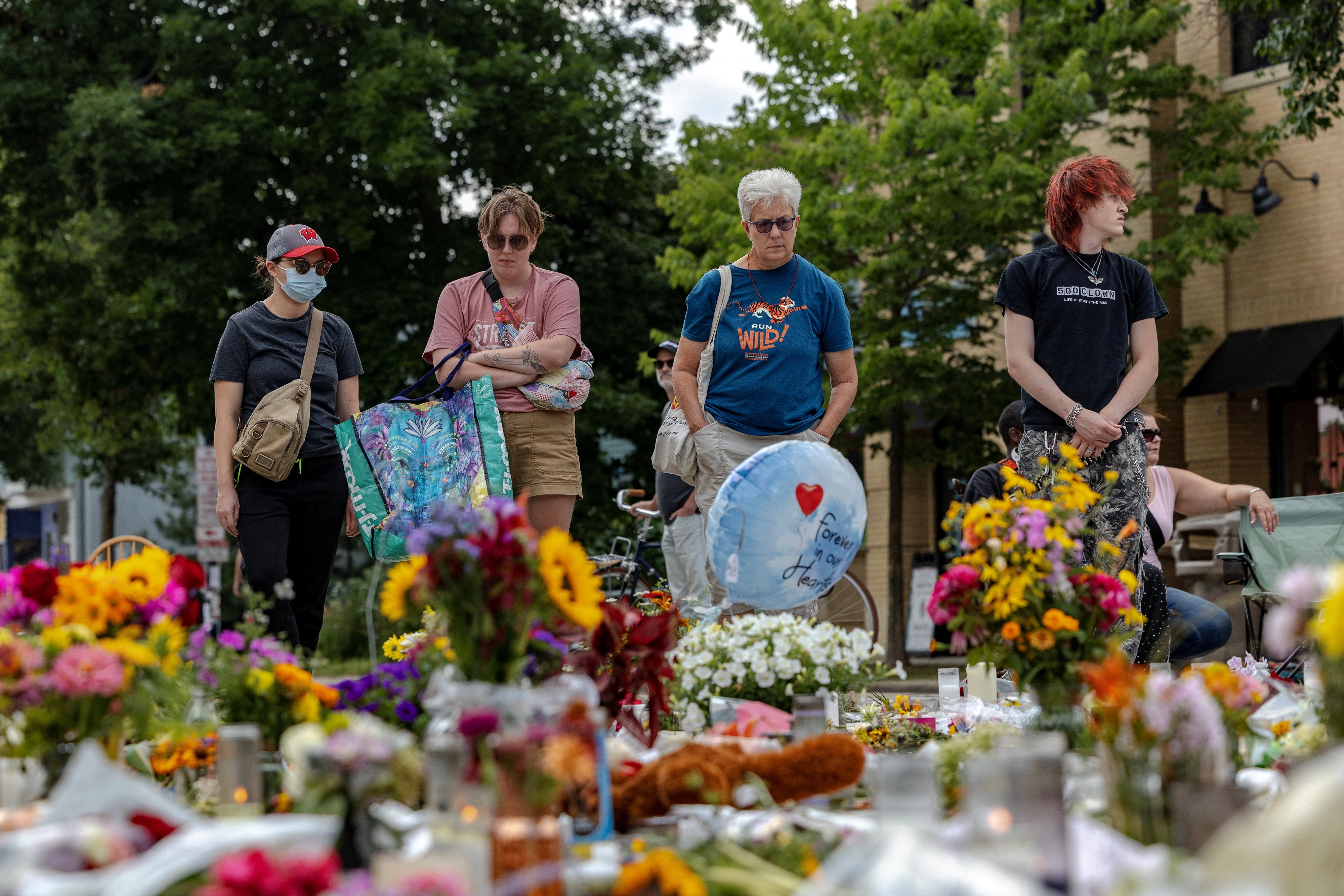 Mourners stitchery astatine a memorial for Corey Ruiz successful Madison
