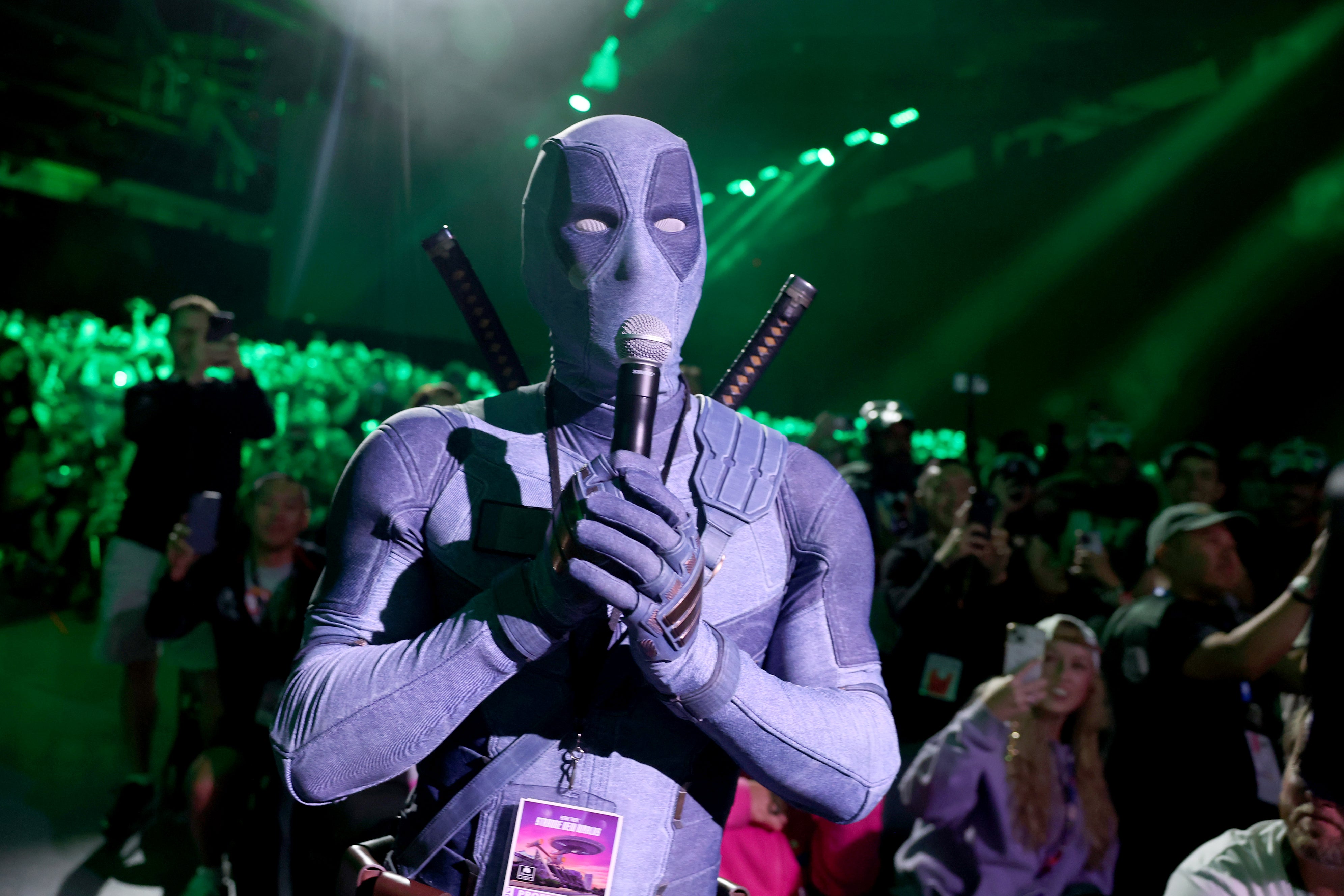 Ryan Reynolds in Deadpool cosplay speaks from the audience during the Marvel Studios Panel at 2026 San Diego Comic-Con