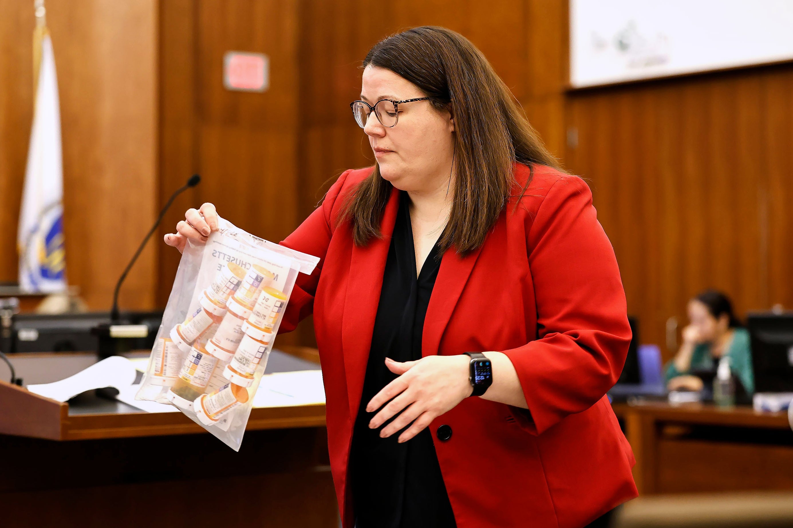 Jennifer Sprague, a prosecutor with the Plymouth County District Attorney's Office, enters a bag of prescription pills as evidence in Lindsay Clancy's trial