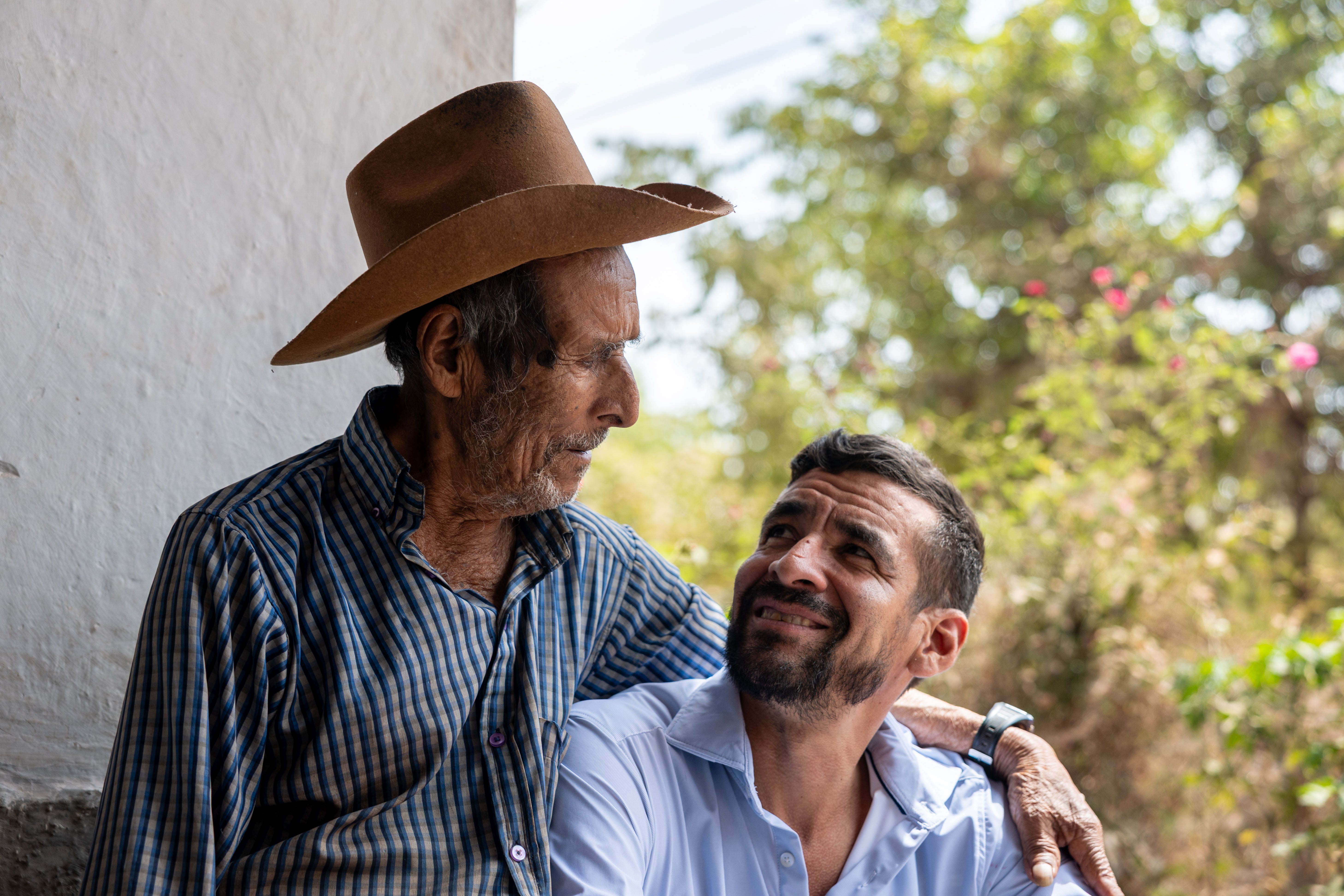 Marvin Suazo, right, visits his 100-year-old grandfather, Esteban Suazo, successful El Junco, Salvador, 1 time aft self-deporting from nan US connected May 26, 2026