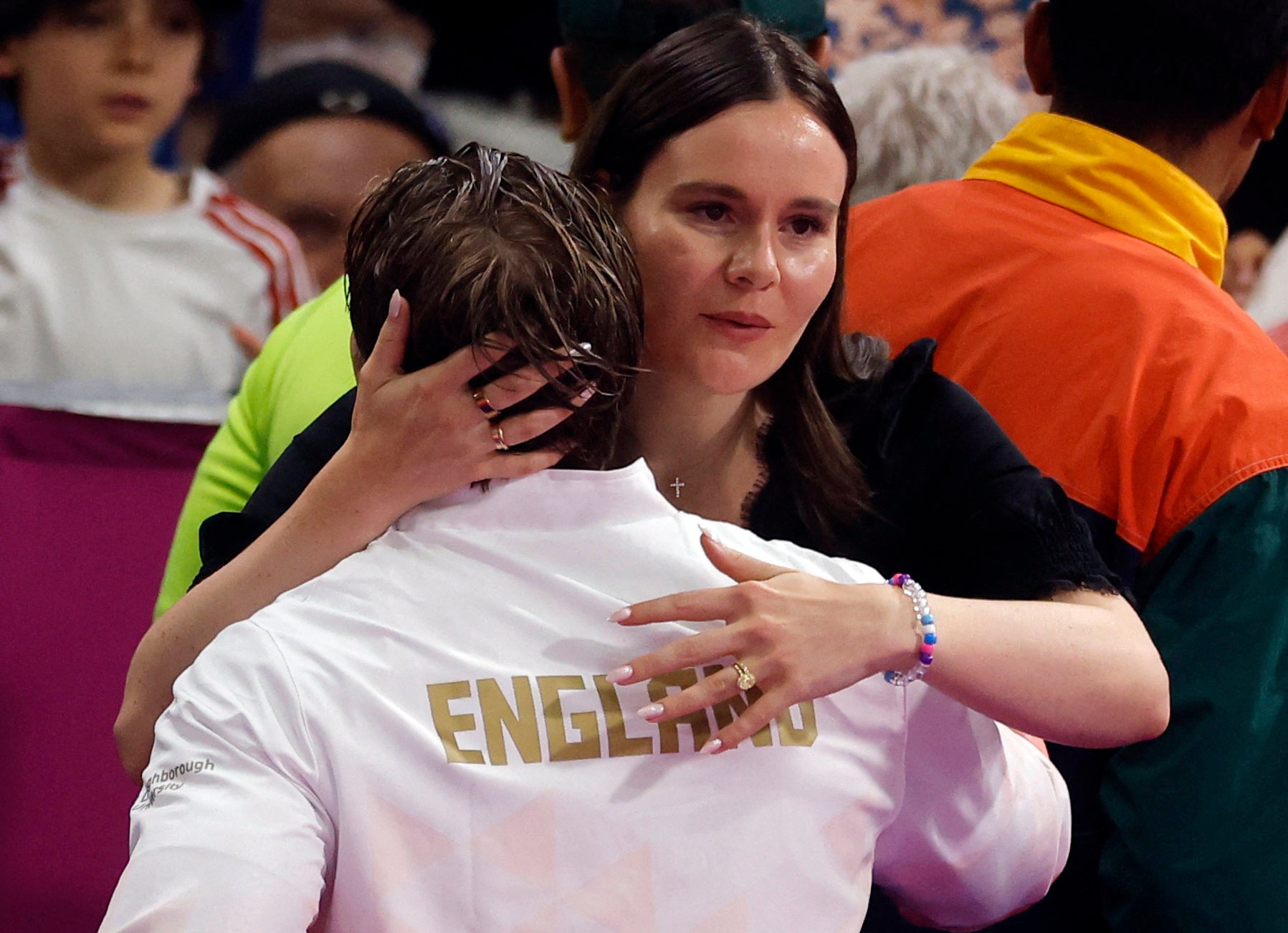 Ramsay-Peaty hugs his wife, Holly