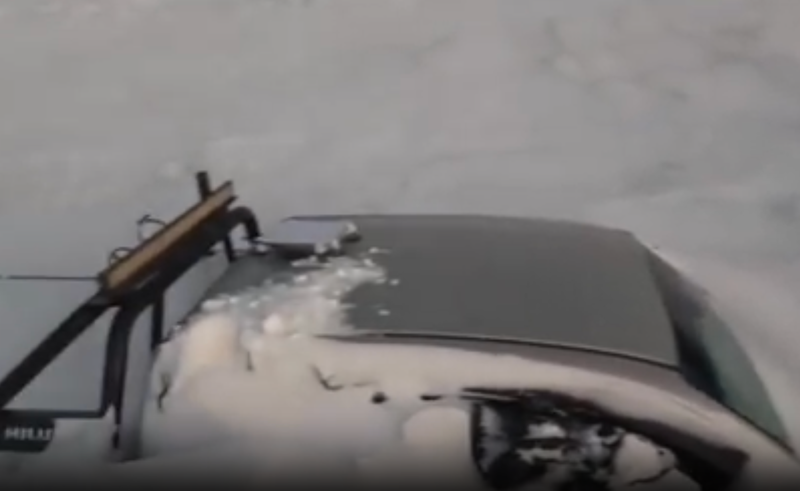 One of nan pick-up trucks half-buried by nan snowstorm