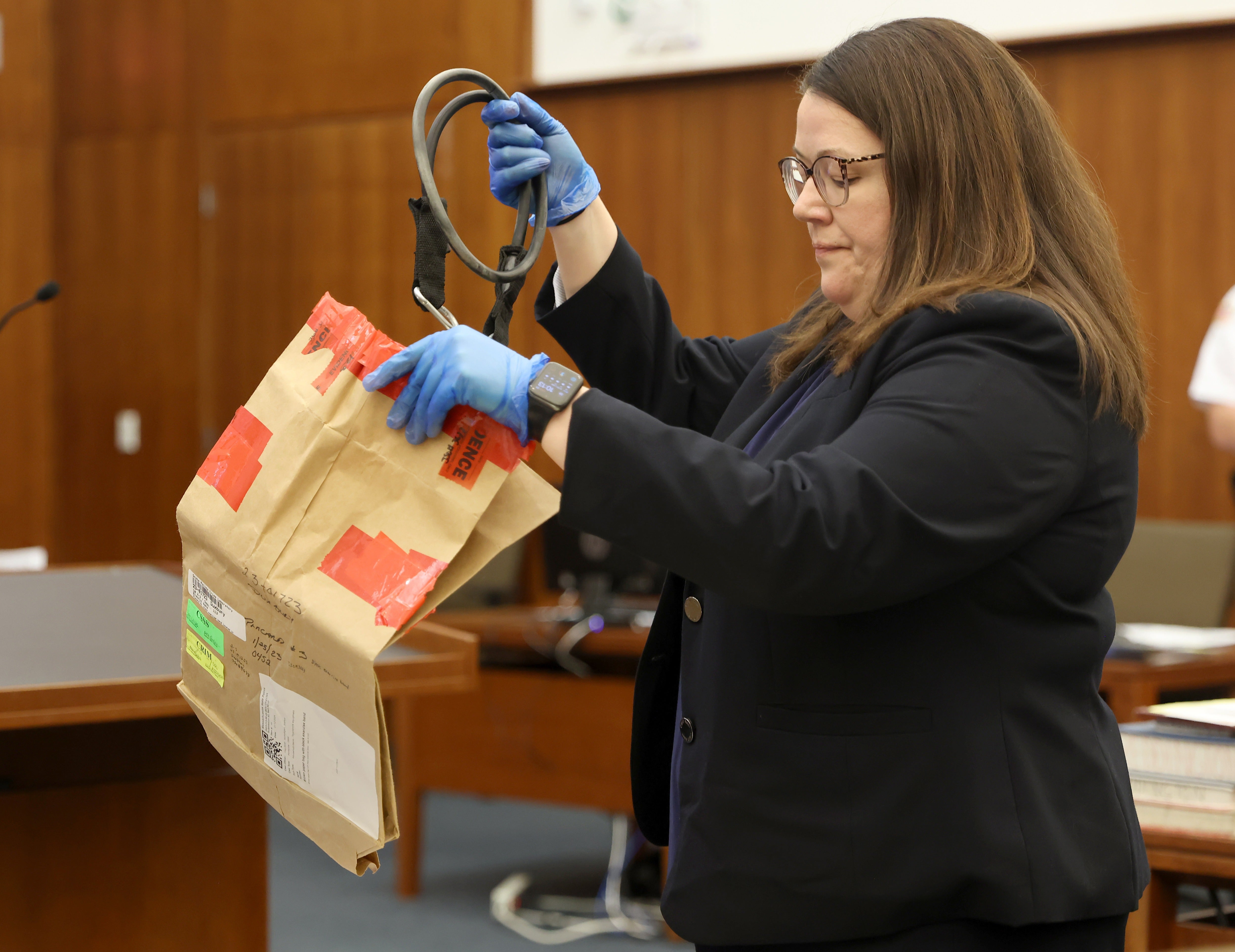 Jurors were shown the exercise bands used to strangle the three children