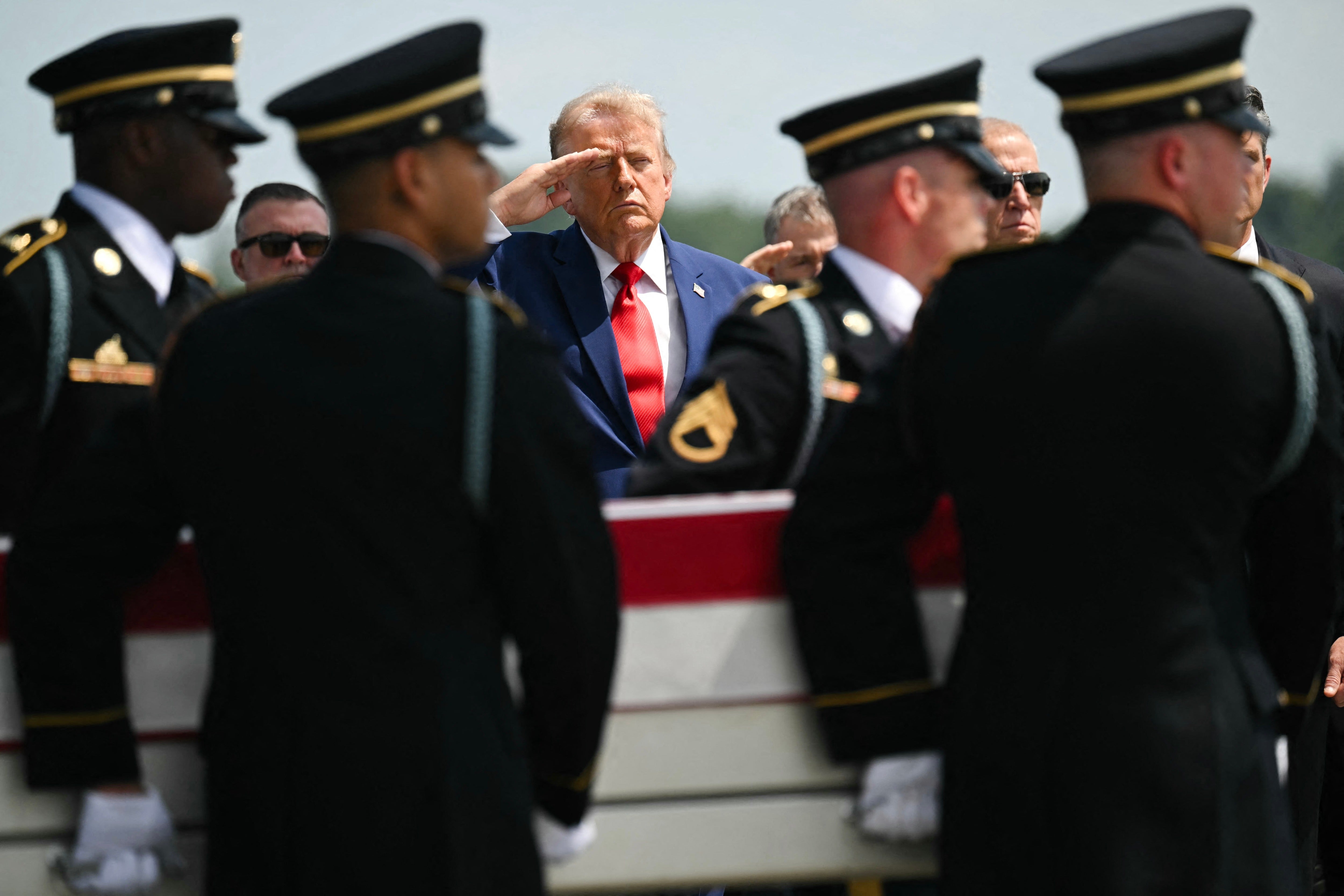 Trump salutes astatine a honorable transportation of nan remains of deceased work members connected July 22