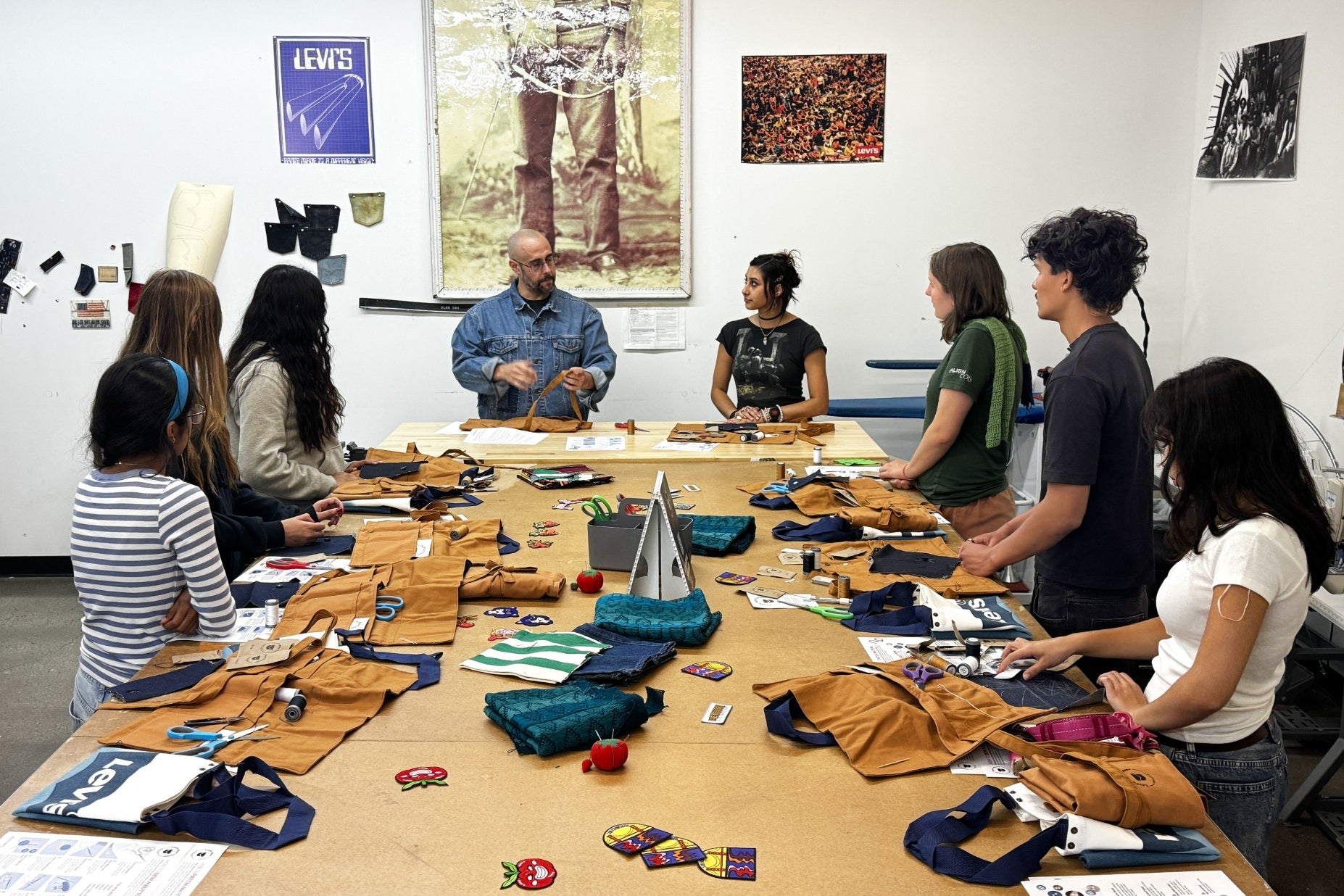 Levi’s employees teach students during a sewing workshop at a Levi's retail store in downtown San Francisco